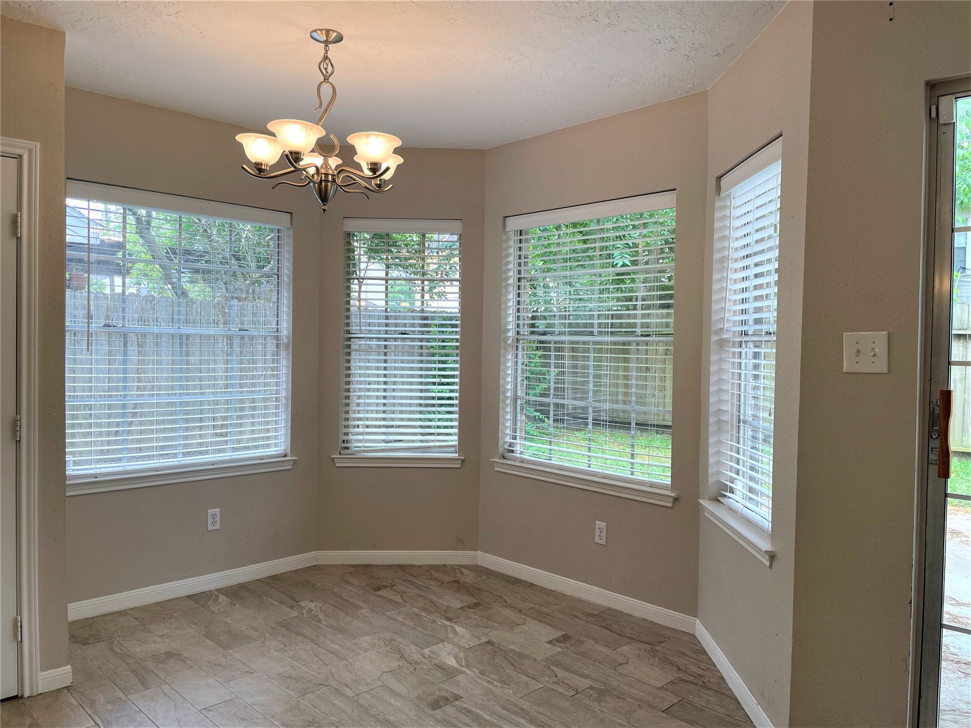 8406 Lake Crystal Drive, Houston, TX 77095 The charming breakfast area that flows seamlessly from the kitchen, creates a cozy nook for those leisurely morning meals. This inviting space is bathed in natural light, thanks to large windows that offer a view of the backyard or garden.