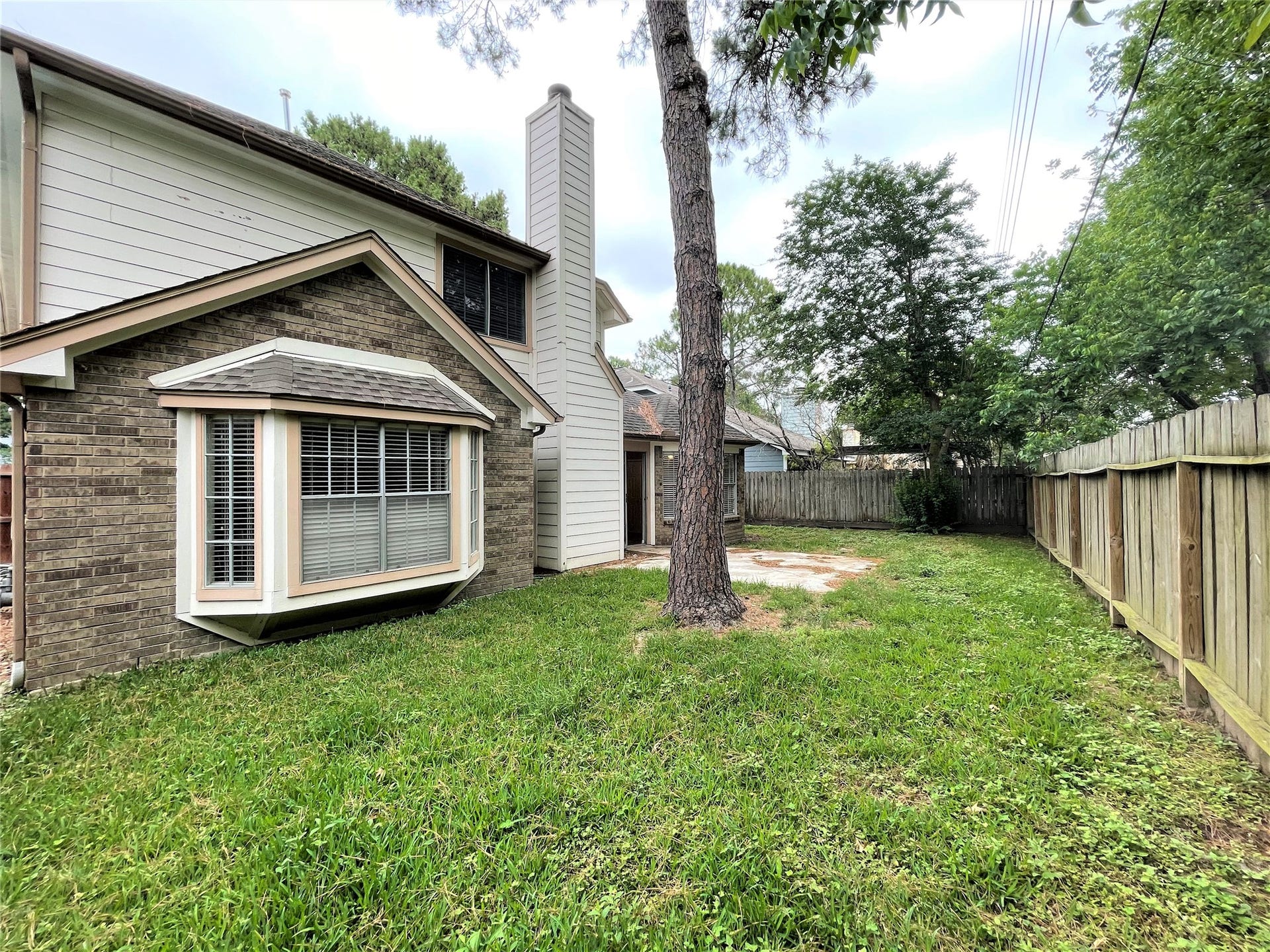 8406 Lake Crystal Drive, Houston, TX 77095 Step into the backyard and be greeted by a spacious and inviting area. It's perfect for outdoor entertainment and relaxation.