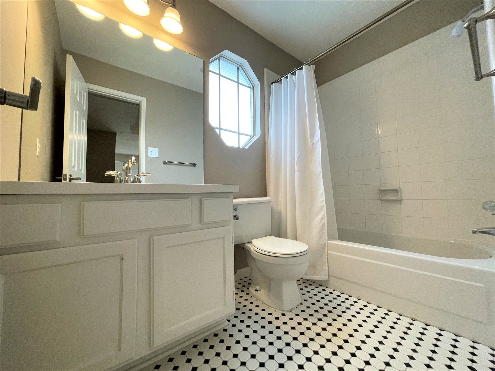 8406 Lake Crystal Drive, Houston, TX 77095 The secondary bathroom features granite counter tops with a bath/shower combo. Ready for your daily needs.