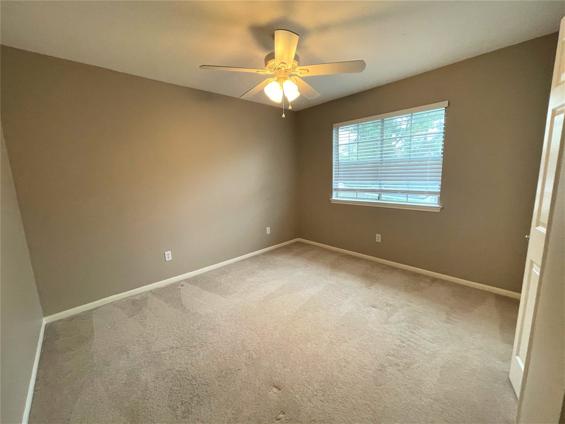 8406 Lake Crystal Drive, Houston, TX 77095 The third bedroom offers ample space for rest and relaxation. It's ideal for guests.