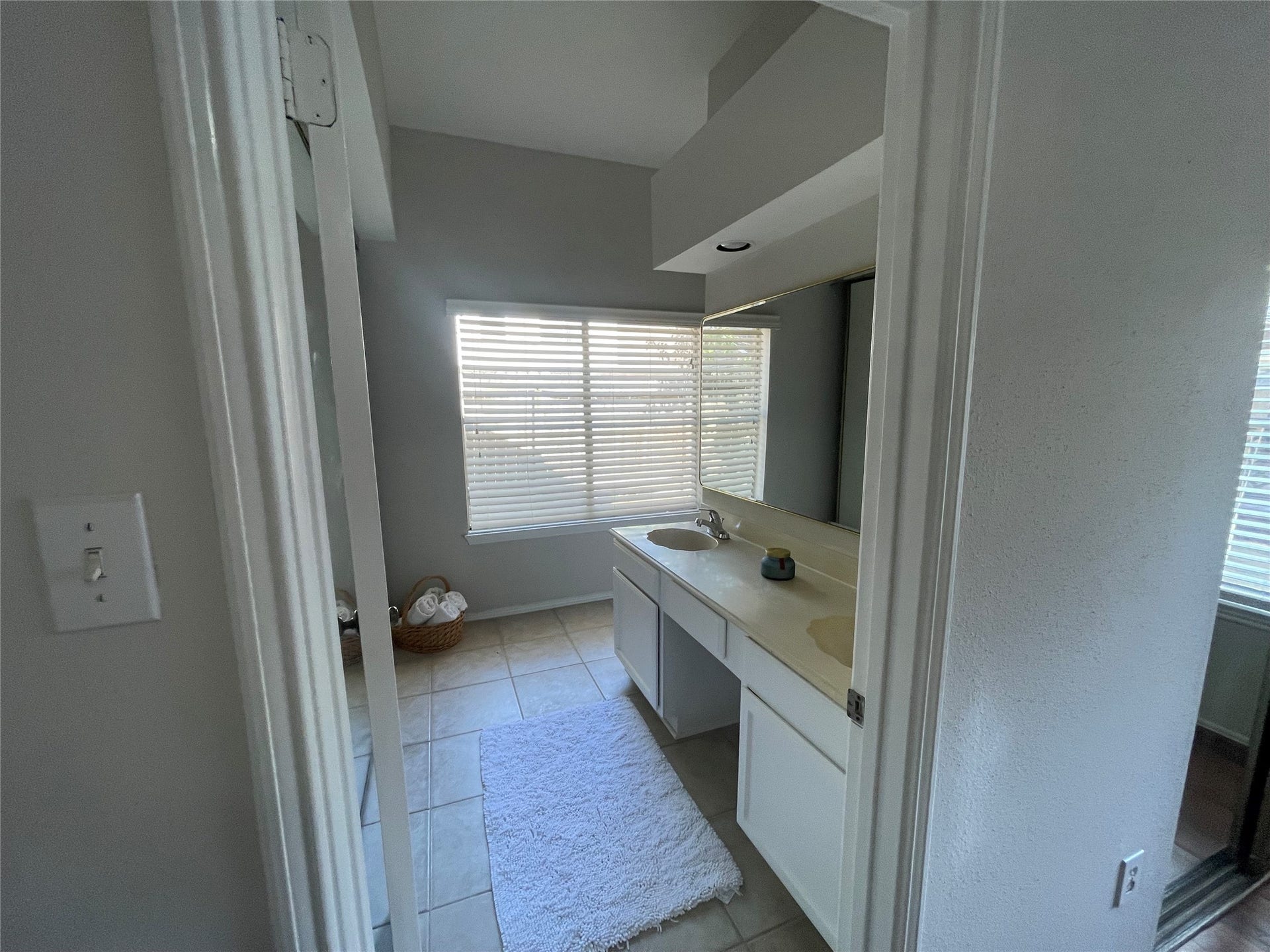 Private bathroom with large closet for primary bedroom