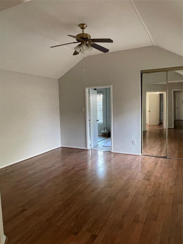 Primary bedroom with mirrored closet