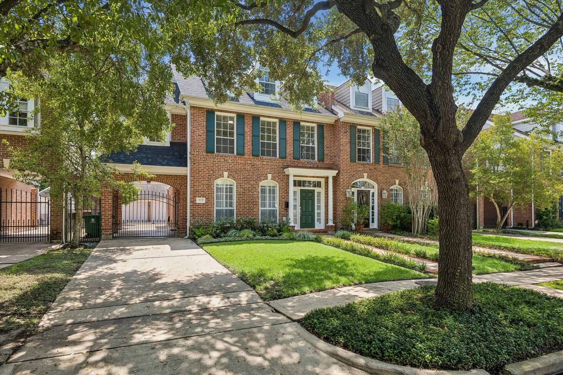 1613 Norfolk Street, Houston, TX 77006 Driveway with gate, porte-cochre, and detached 2 car agarage.
