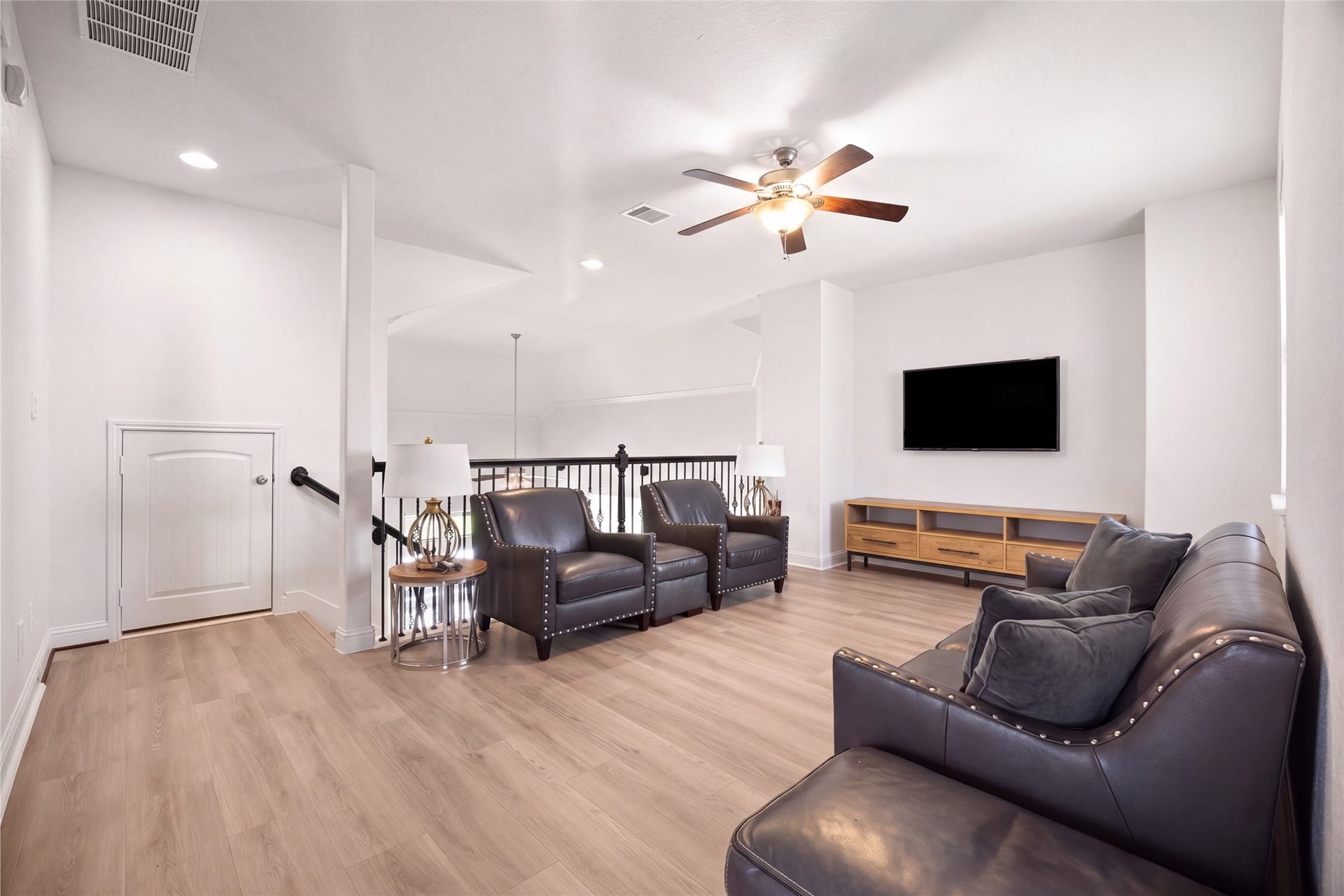 UPSTAIRS FAMILY ROOM  Spacious upstairs family room offers a flexible secondary living space and access to the secondary bedrooms.