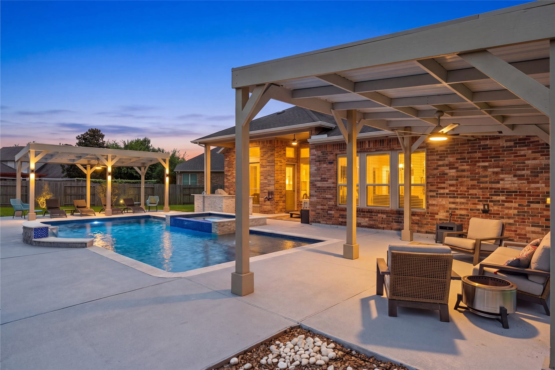With a backyard oasis that features three covered patios with lighting and ceiling fans, outdoor kitchen and resort style pool.