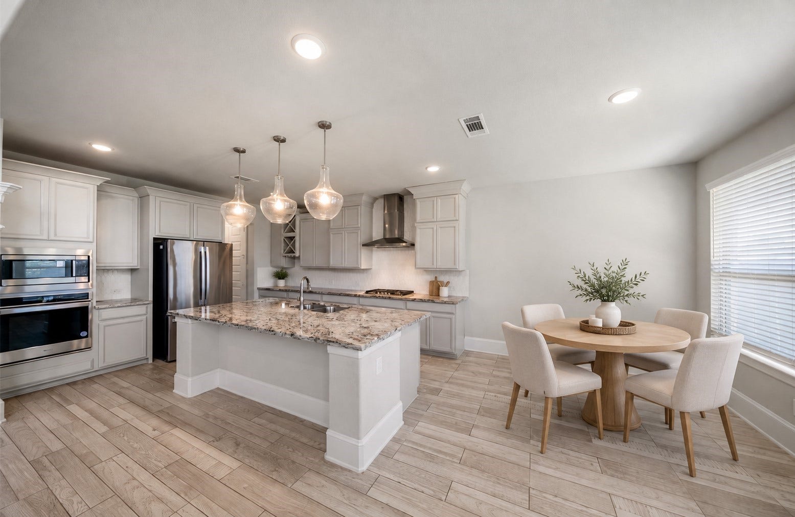 27106 Spanish Wind Court, Magnolia, TX 77354 This kitchen is open to the living room and offers a breakfast bar and breakfast room.