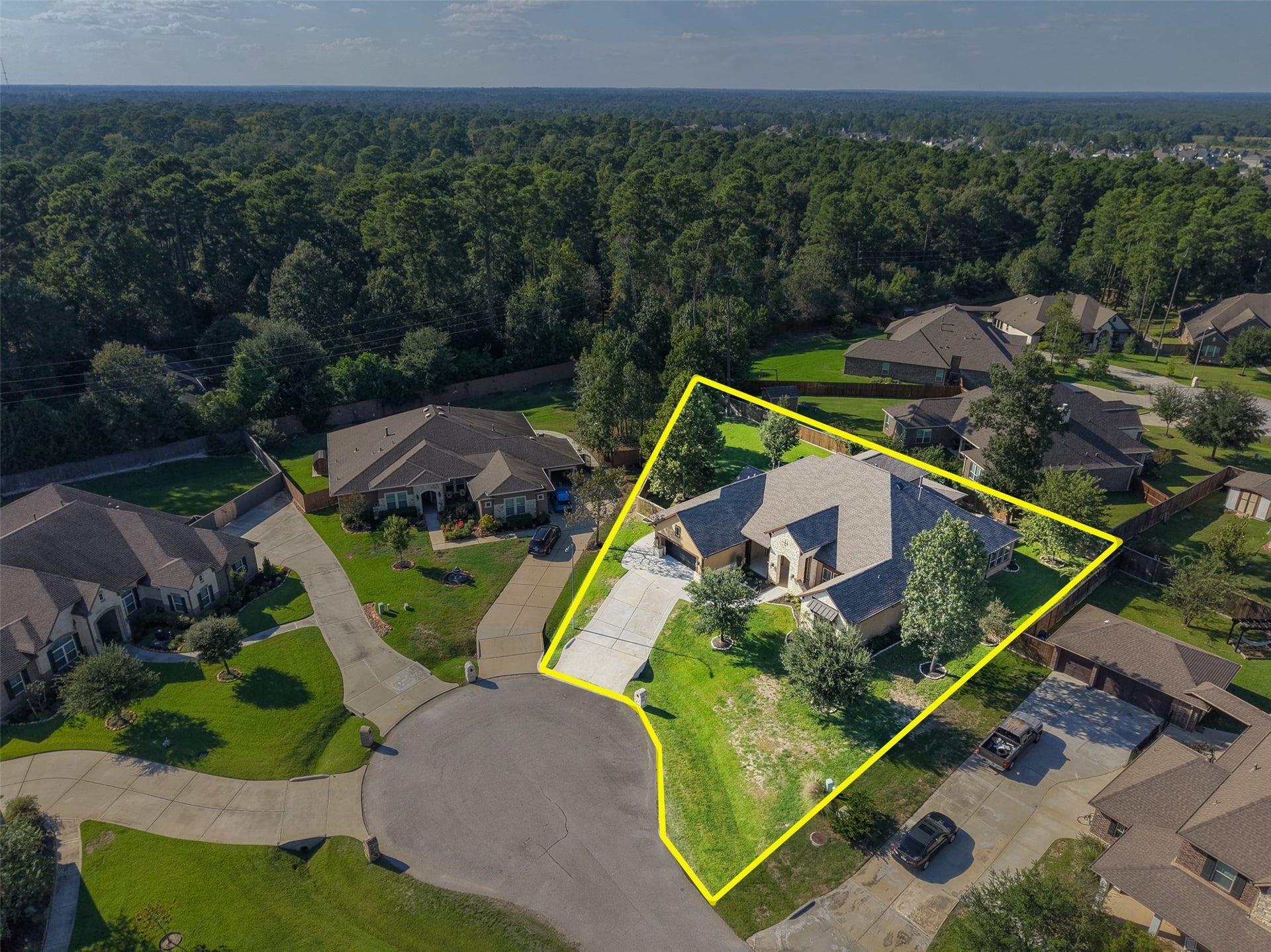 12606 Whitney Court, Magnolia, TX 77354 An oversized, pie-shaped cul-de-sac lot provides generous outdoor space and separation from neighboring homes.