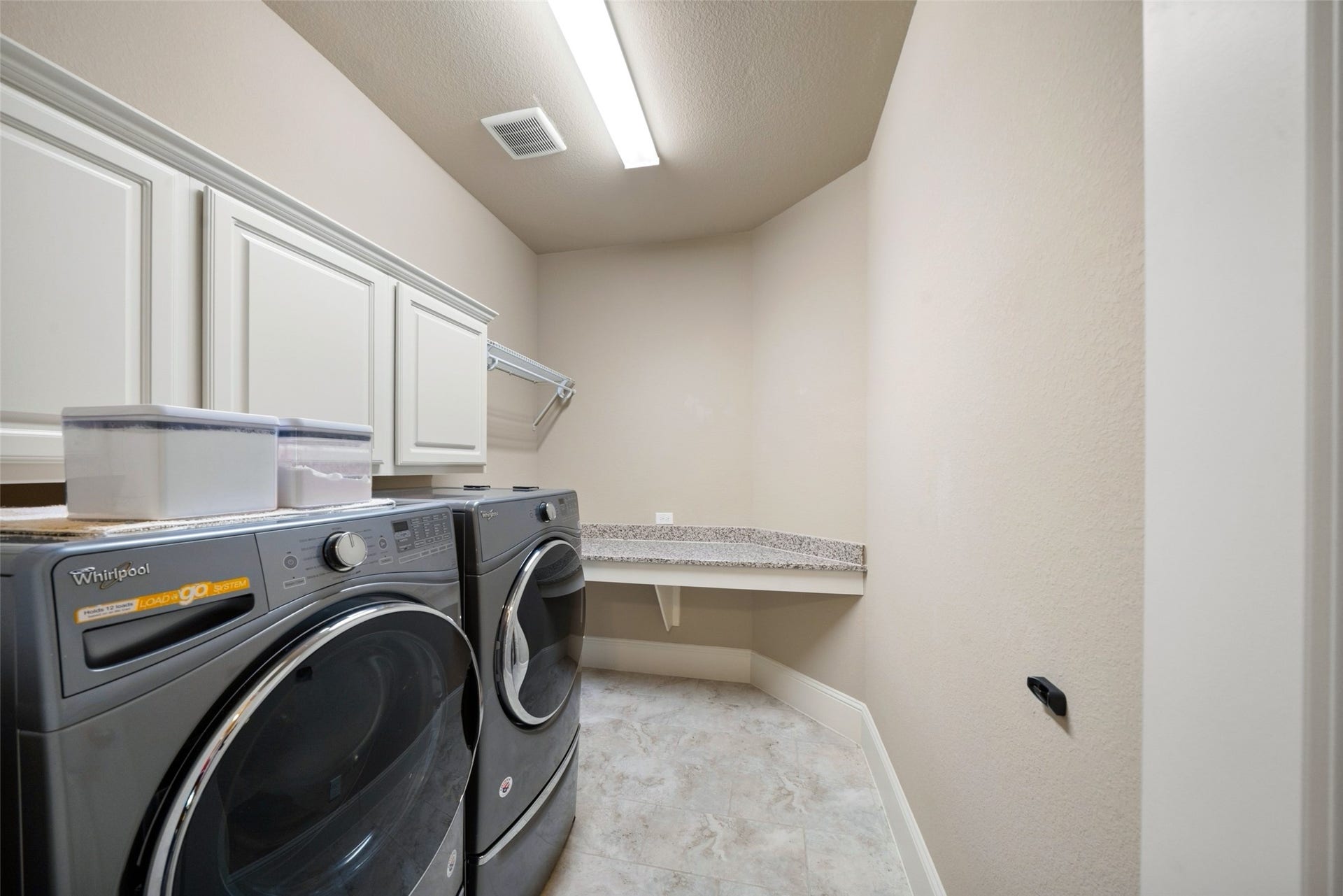 12606 Whitney Court, Magnolia, TX 77354 A well-sized laundry room on the first floor large enough to manage laundry and store all the essentials of maintaining the home.
