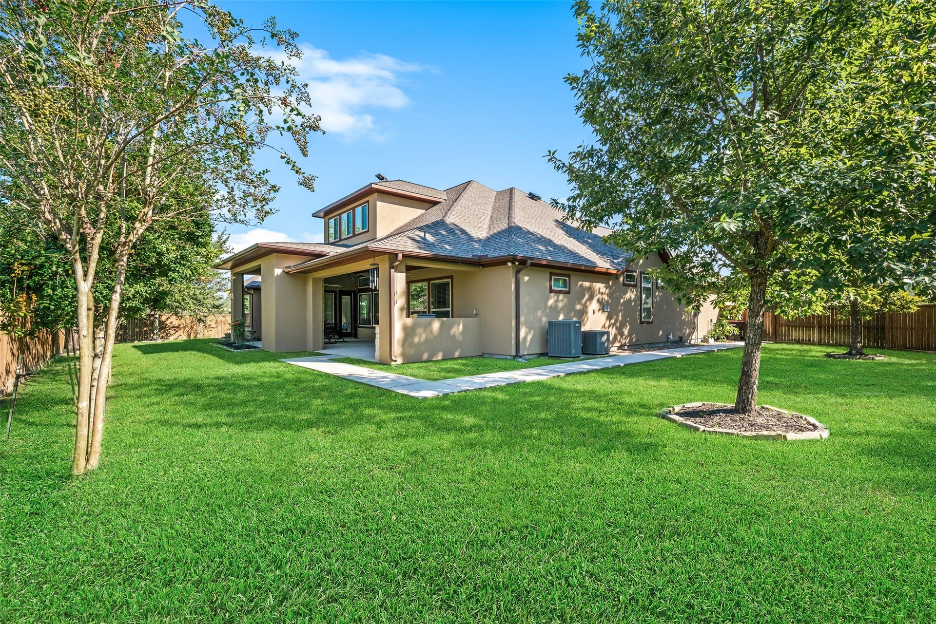 12606 Whitney Court, Magnolia, TX 77354 The expansive, fully fenced backyard offers plenty of room for a future pool, outdoor activities and entertaining.