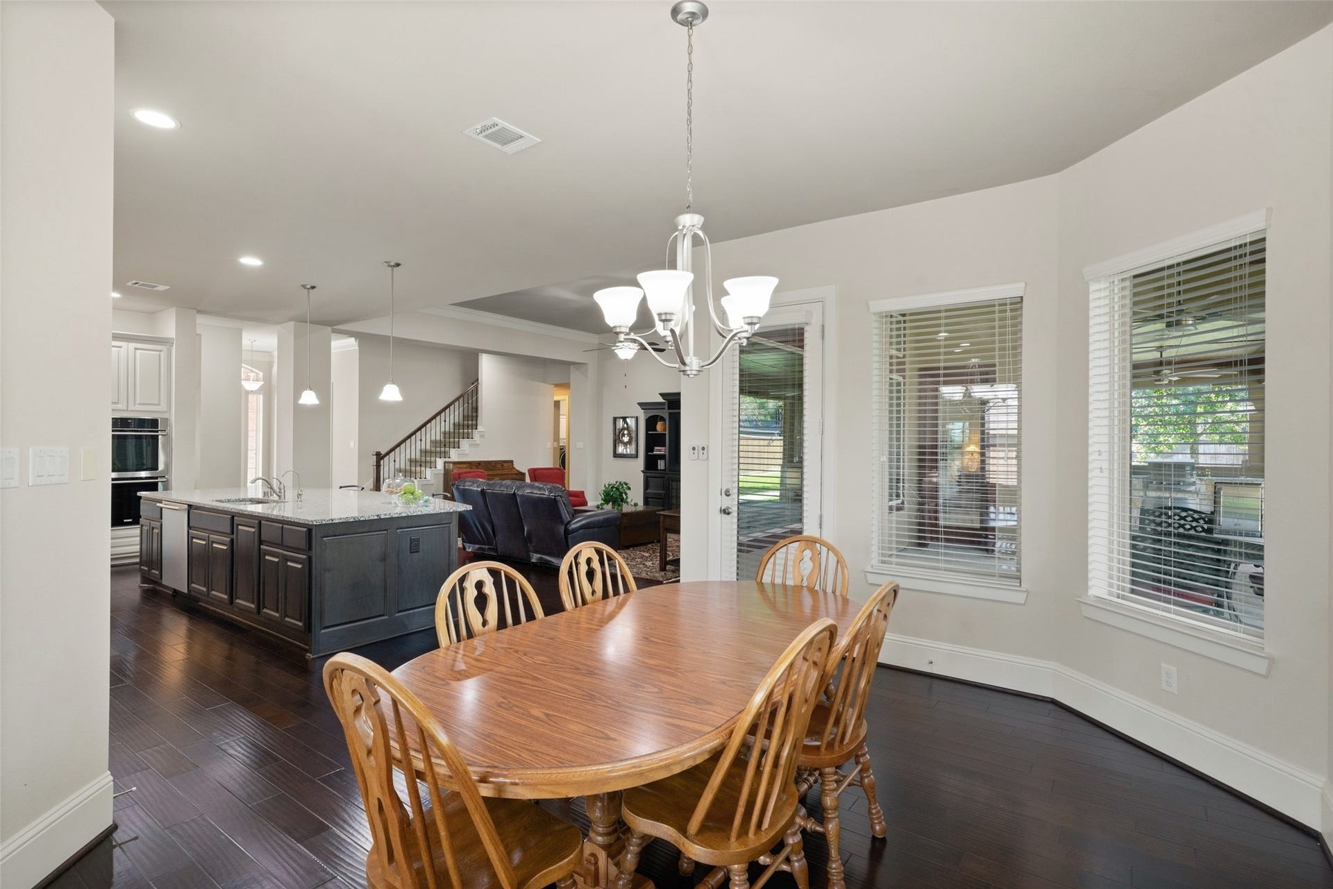 12606 Whitney Court, Magnolia, TX 77354 The breakfast area opens to the kitchen and family room, creating an easy flow for everyday living and entertaining.