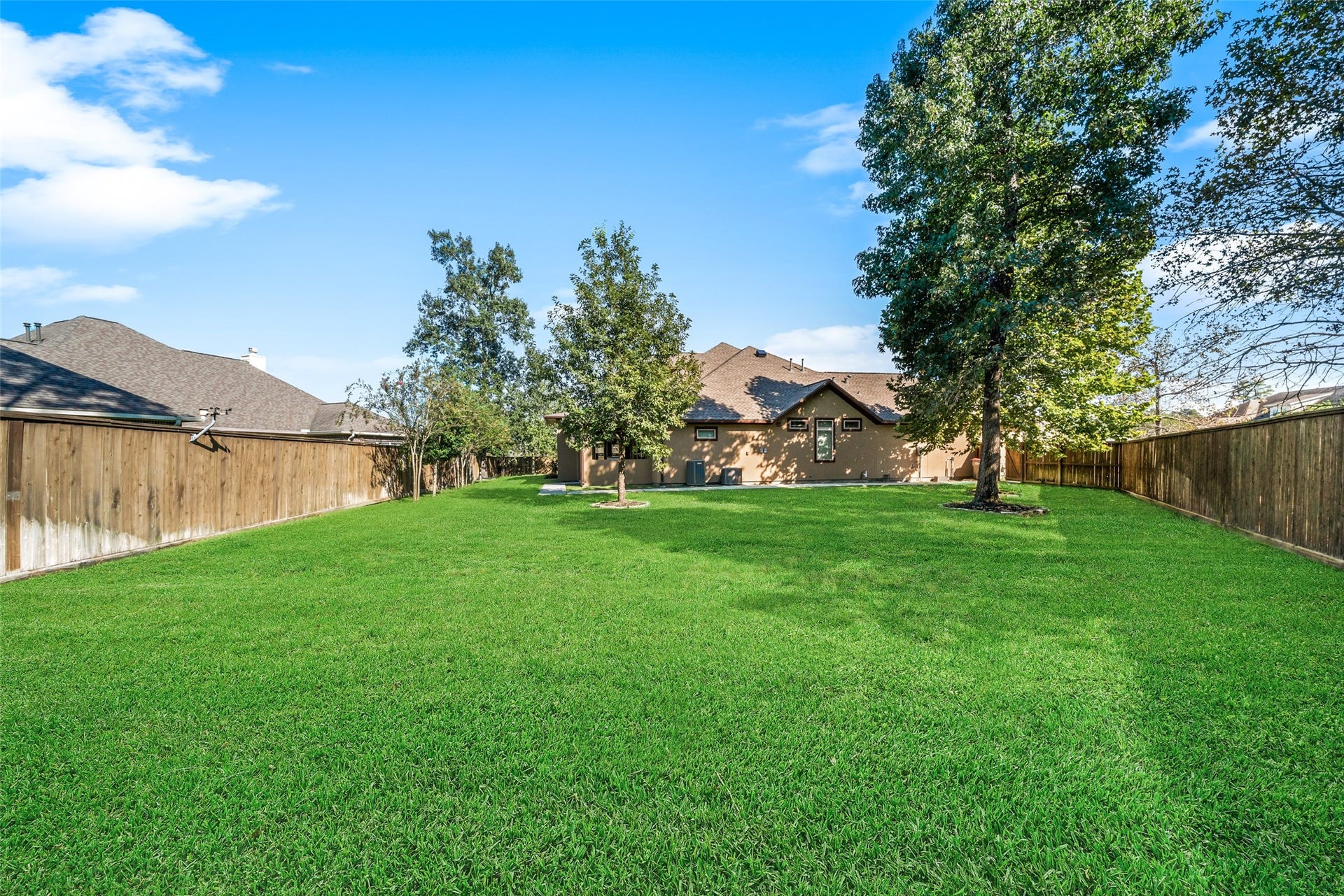 12606 Whitney Court, Magnolia, TX 77354 An oversized, fully fenced backyard offers ample room for a future pool while leaving plenty of space to play and entertain.