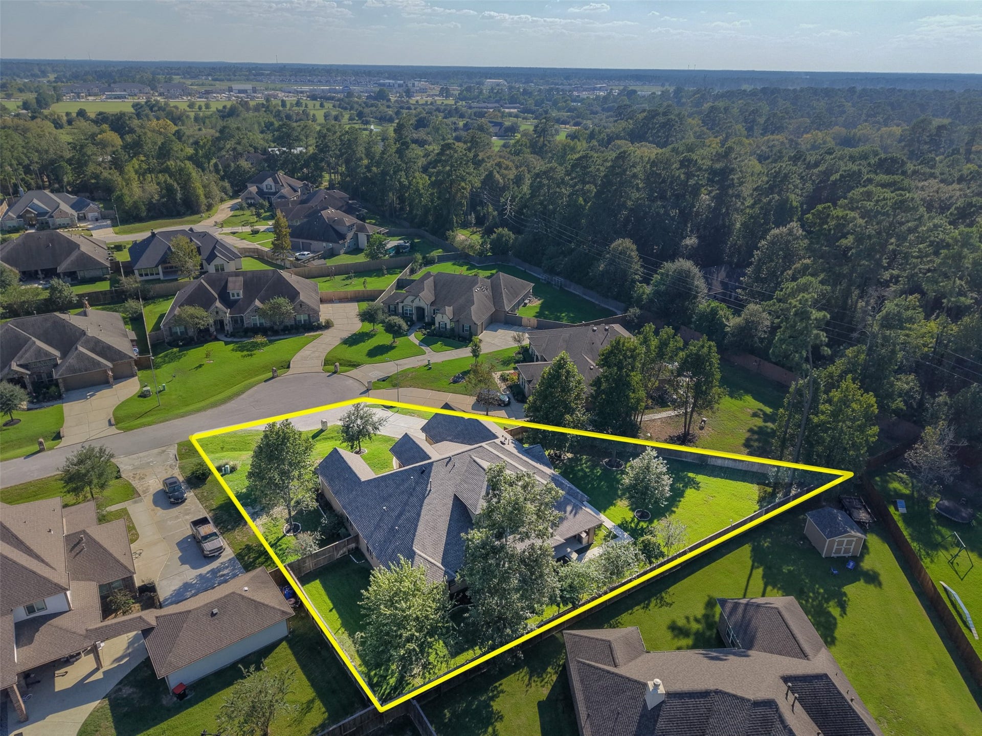 12606 Whitney Court, Magnolia, TX 77354 Located at the end of the cul de sac with a large yard offering space for a future pool, play space, sport court or garden.