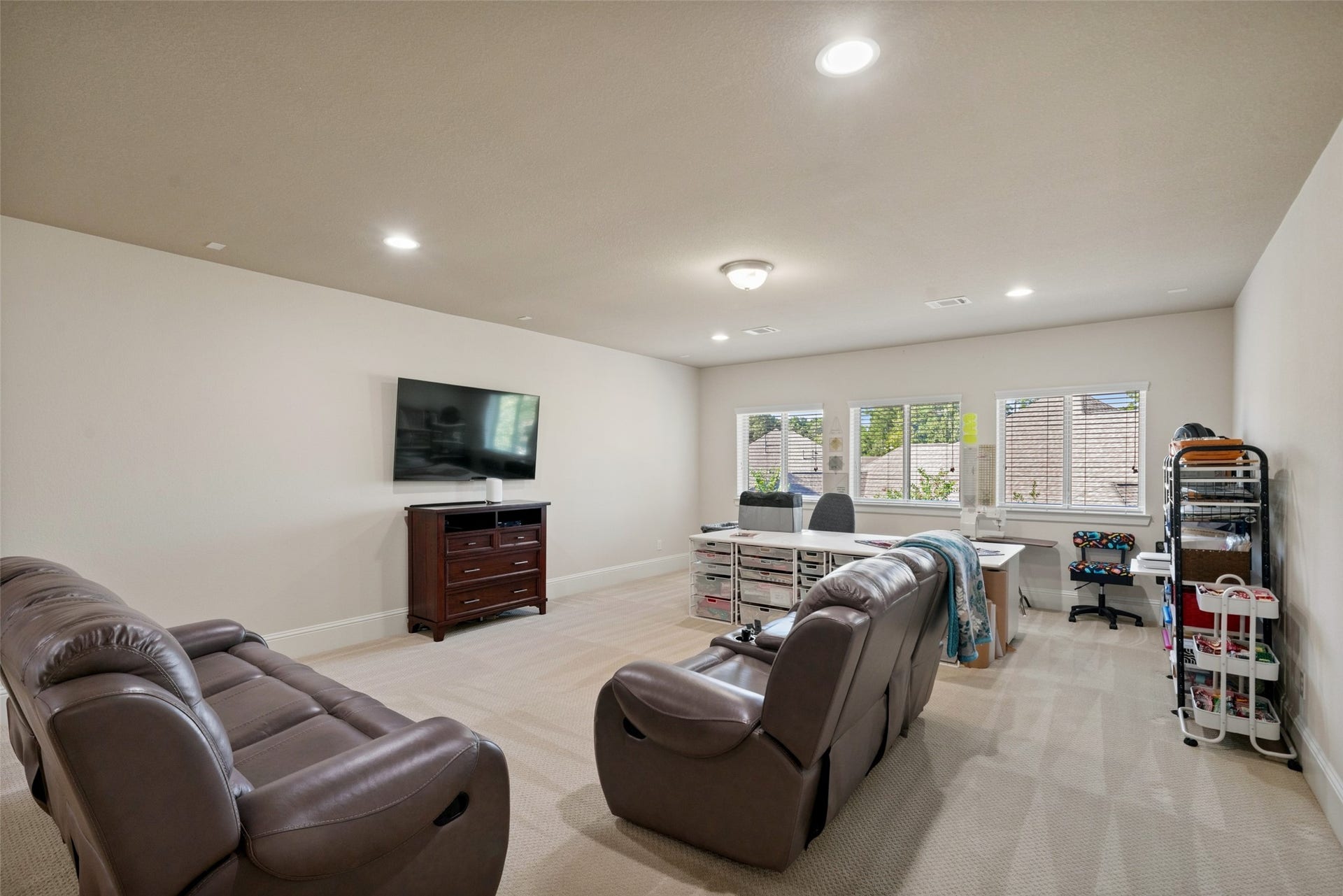 12606 Whitney Court, Magnolia, TX 77354 This oversized second floor game room overlooks the backyard and is large enough to have game space, lounge space and work space!