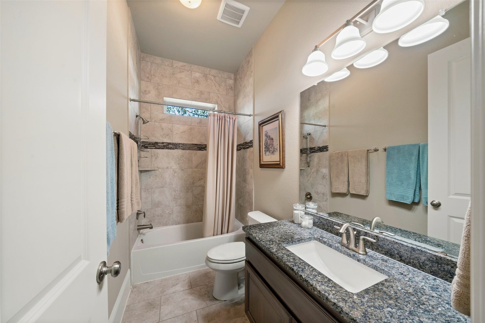 12606 Whitney Court, Magnolia, TX 77354 Secondary bathroom number two features granite counters and upgraded shower tile to the ceiling.
