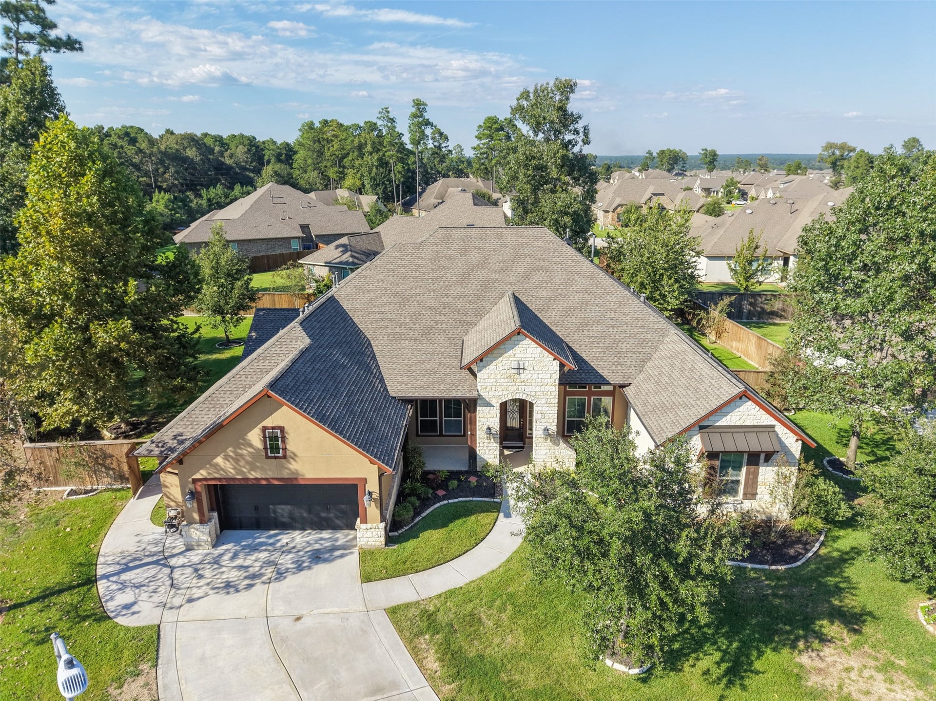 12606 Whitney Court, Magnolia, TX 77354 Recently painted exterior and a new roof installed in 2025 with a 50-year warranty add lasting value to this meticulously maintained home.