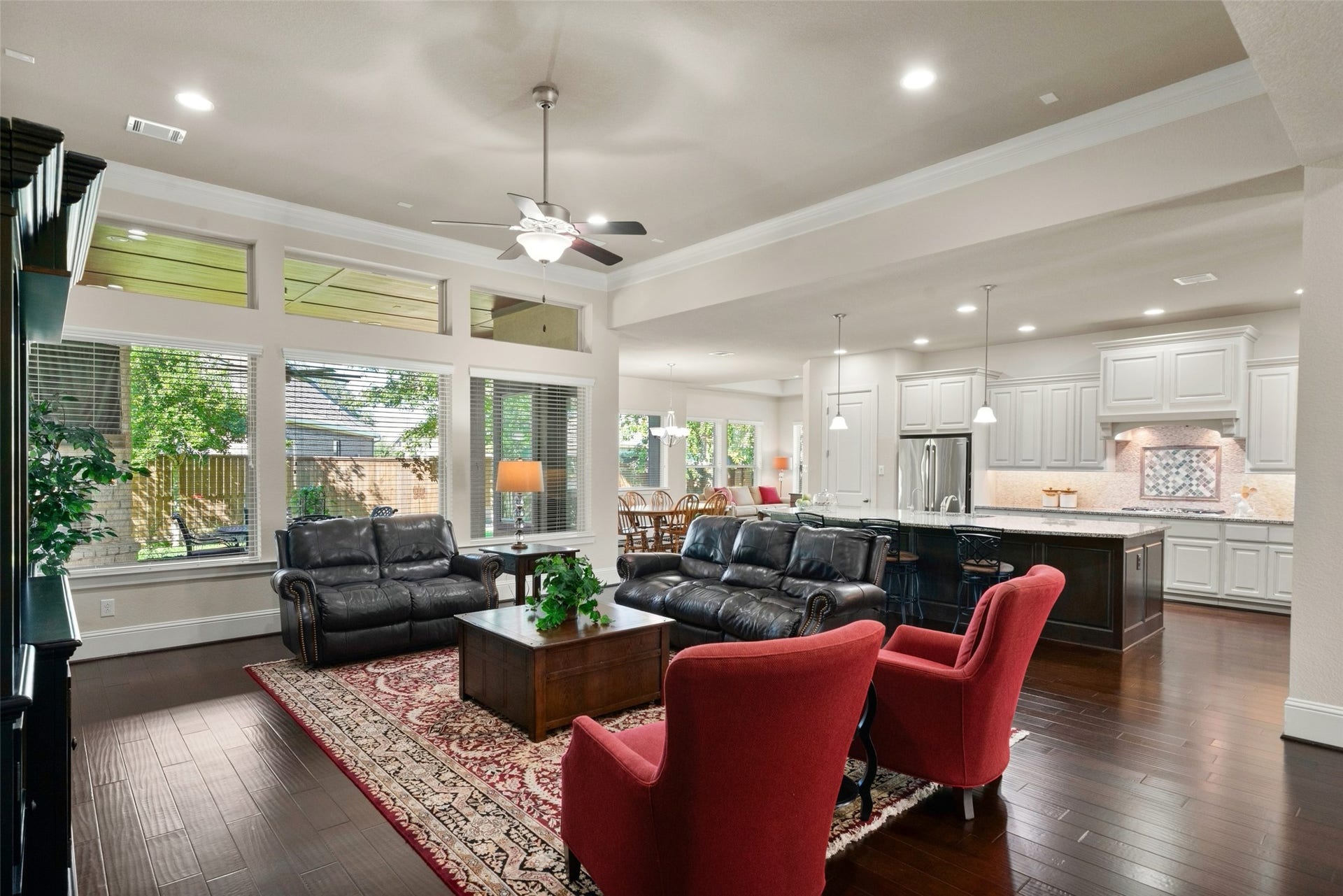 12606 Whitney Court, Magnolia, TX 77354 High ceilings and an open floor plan create a spacious feel, with the family room flowing seamlessly into the kitchen and breakfast area.