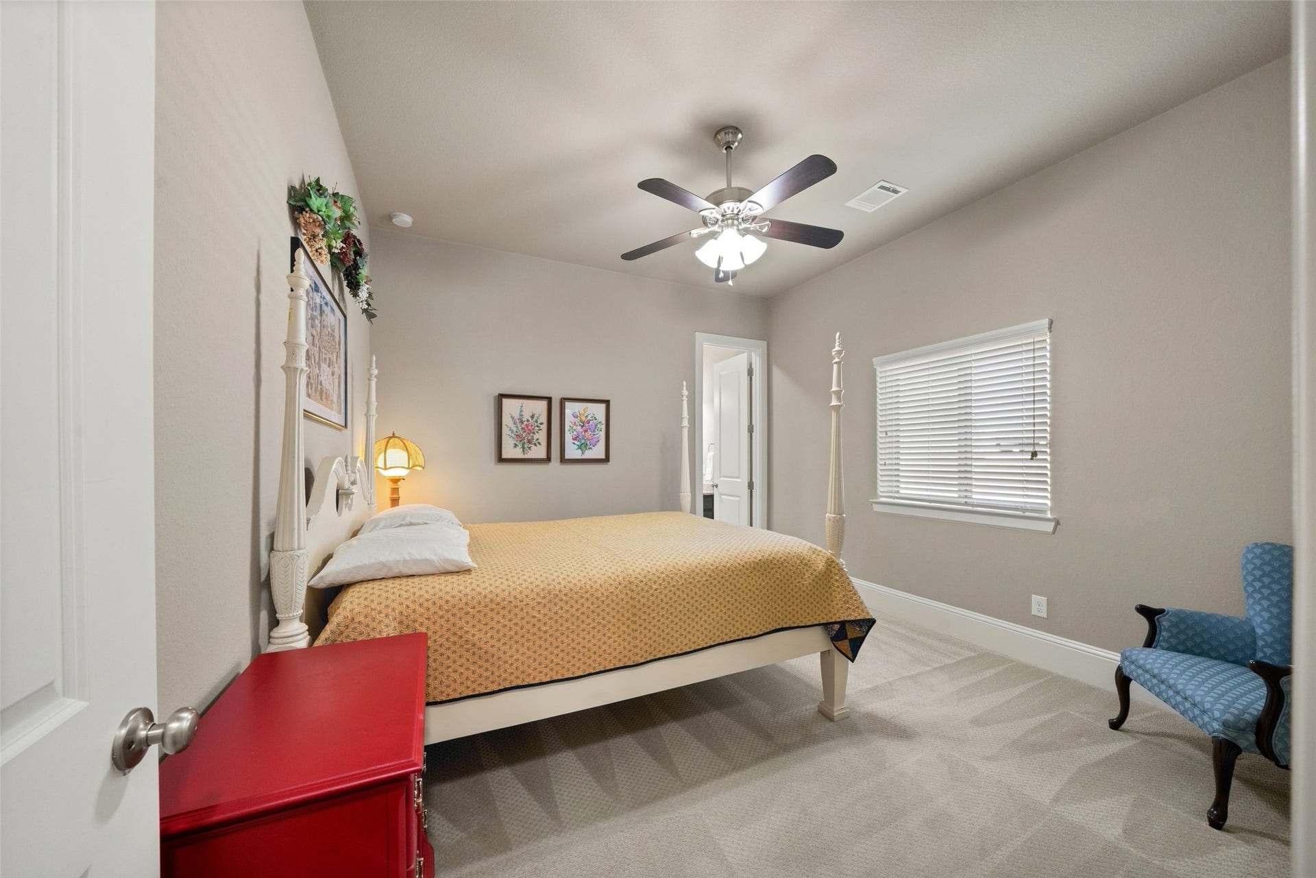 12606 Whitney Court, Magnolia, TX 77354 The first of three secondary bedrooms on the first floor with an en-suite bathroom and walk-in closet.