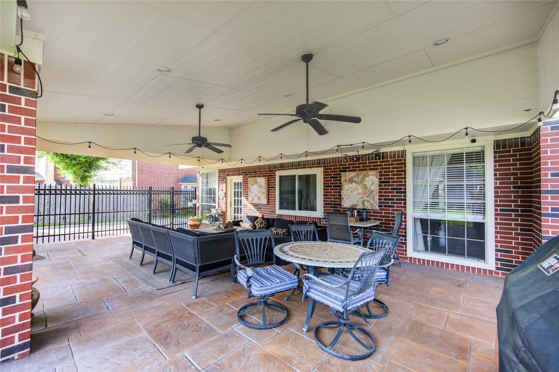 4914 Hillswick Drive, Sugar Land, TX 77479 Dual fans under the covered patio - ideal for relaxing in the shade from Texas heat.