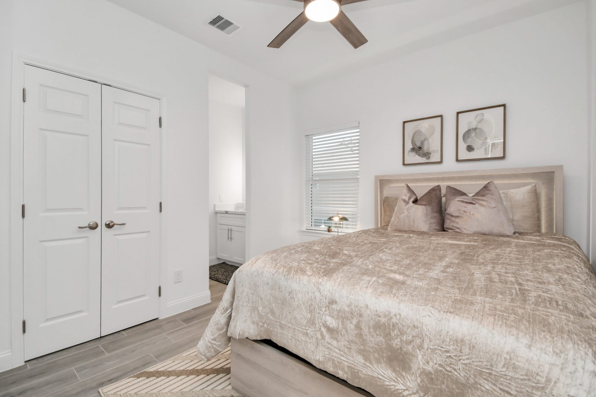 7812 Jester Street, Houston, TX 77051 A bright bedroom offers a comfortable place to unwind, complete with a ceiling fan, dedicated vanity area, and closet space for convenient organization.