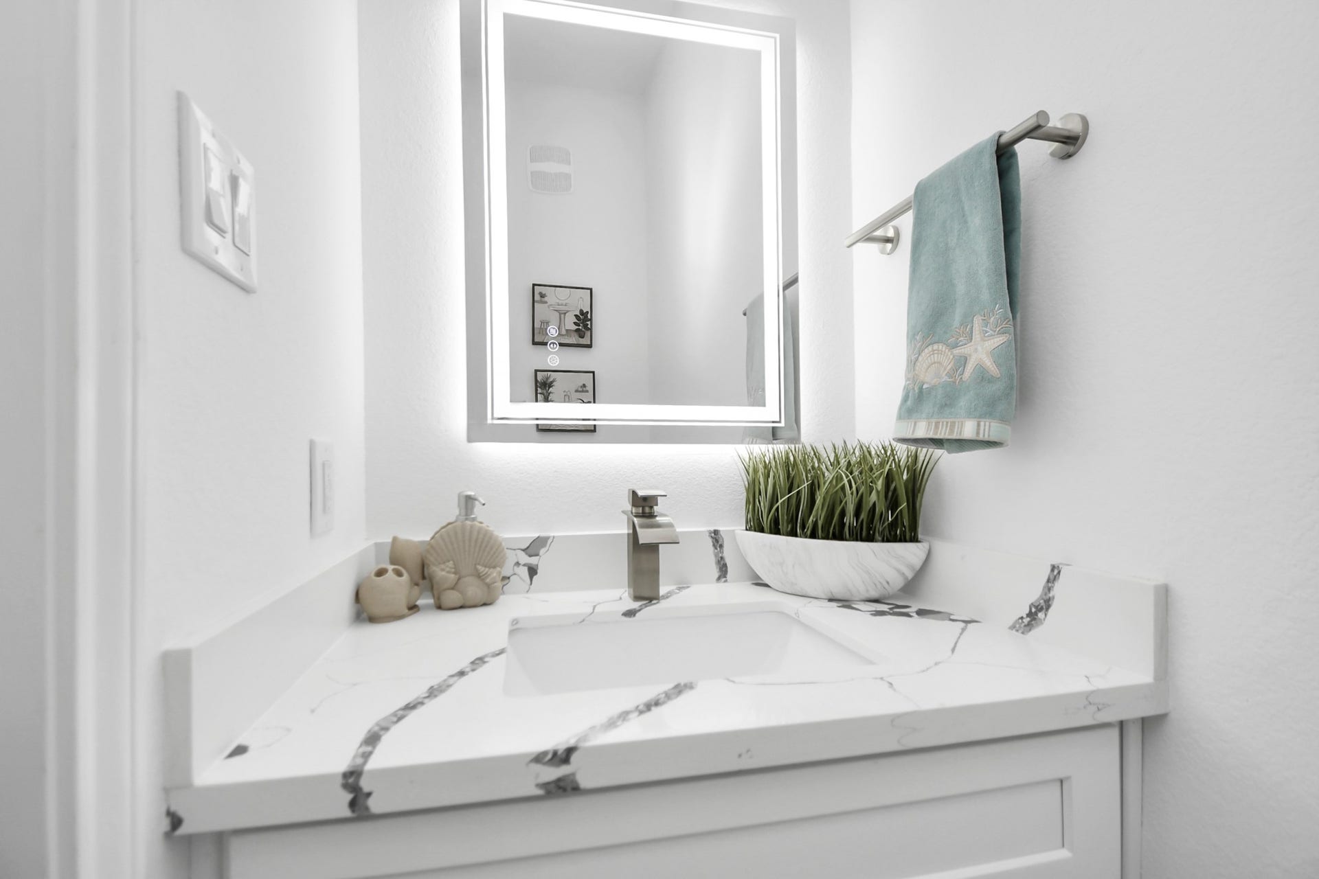 7812 Jester Street, Houston, TX 77051 A contemporary vanity gives the convenient half bath a polished finish, with clean lines and a sophisticated palette carrying the home's modern aesthetic into this private space.