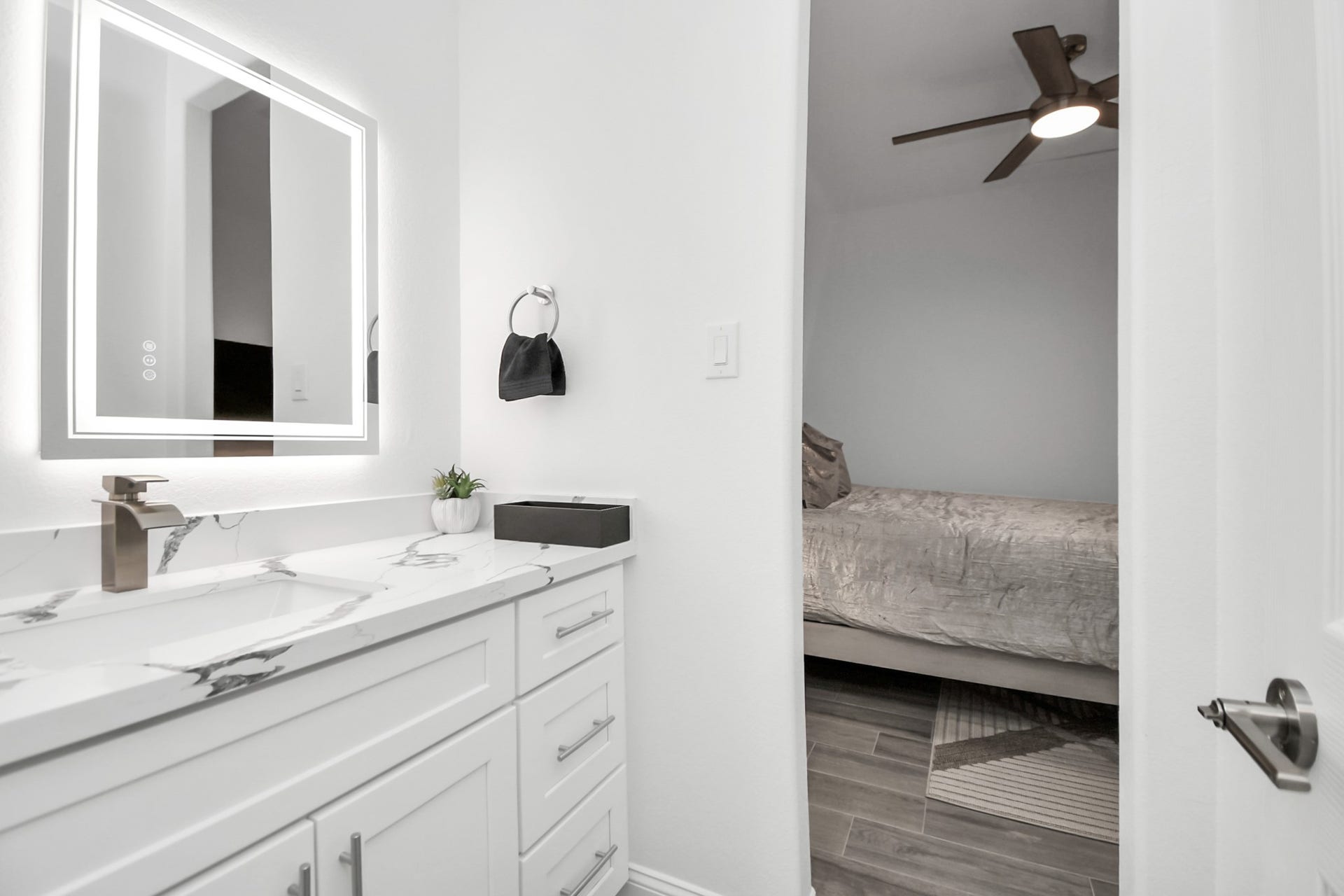 7812 Jester Street, Houston, TX 77051 Set apart from the adjoining full bath, this dedicated vanity area adds a practical touch of luxury and streamlines morning routines.
