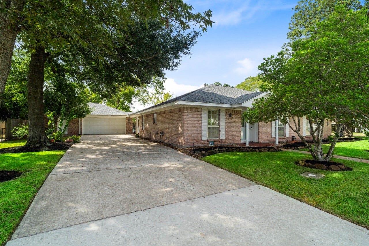 Cute as a button well maintained 1988sqft home in historic Humble.  Ample parking with this driveway leading to a 2-car garage, as well as an extra driveway on the side leading to a covered, enclosed, carport.