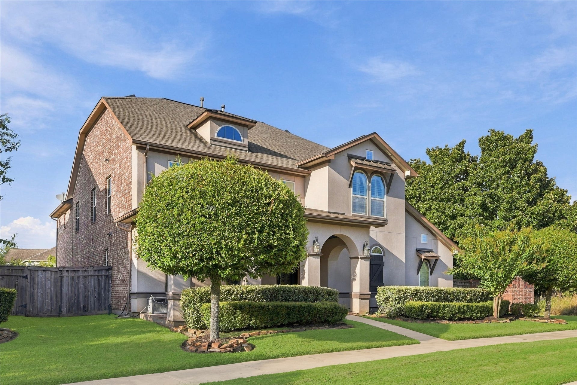 7343 Meadowcroft Boulevard, Sugar Land, TX 77479 A beautiful blend of brick and stucco exterior.