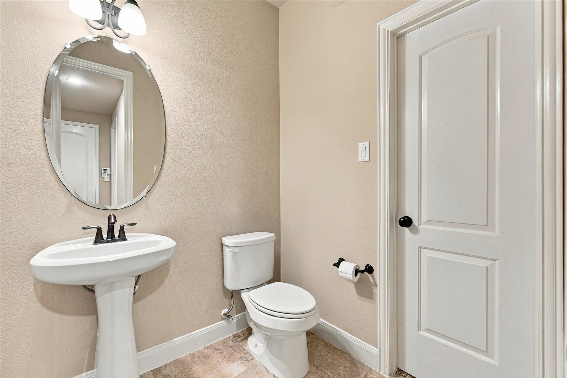 7343 Meadowcroft Boulevard, Sugar Land, TX 77479 Half bath conveniently located on the first floor for guests!