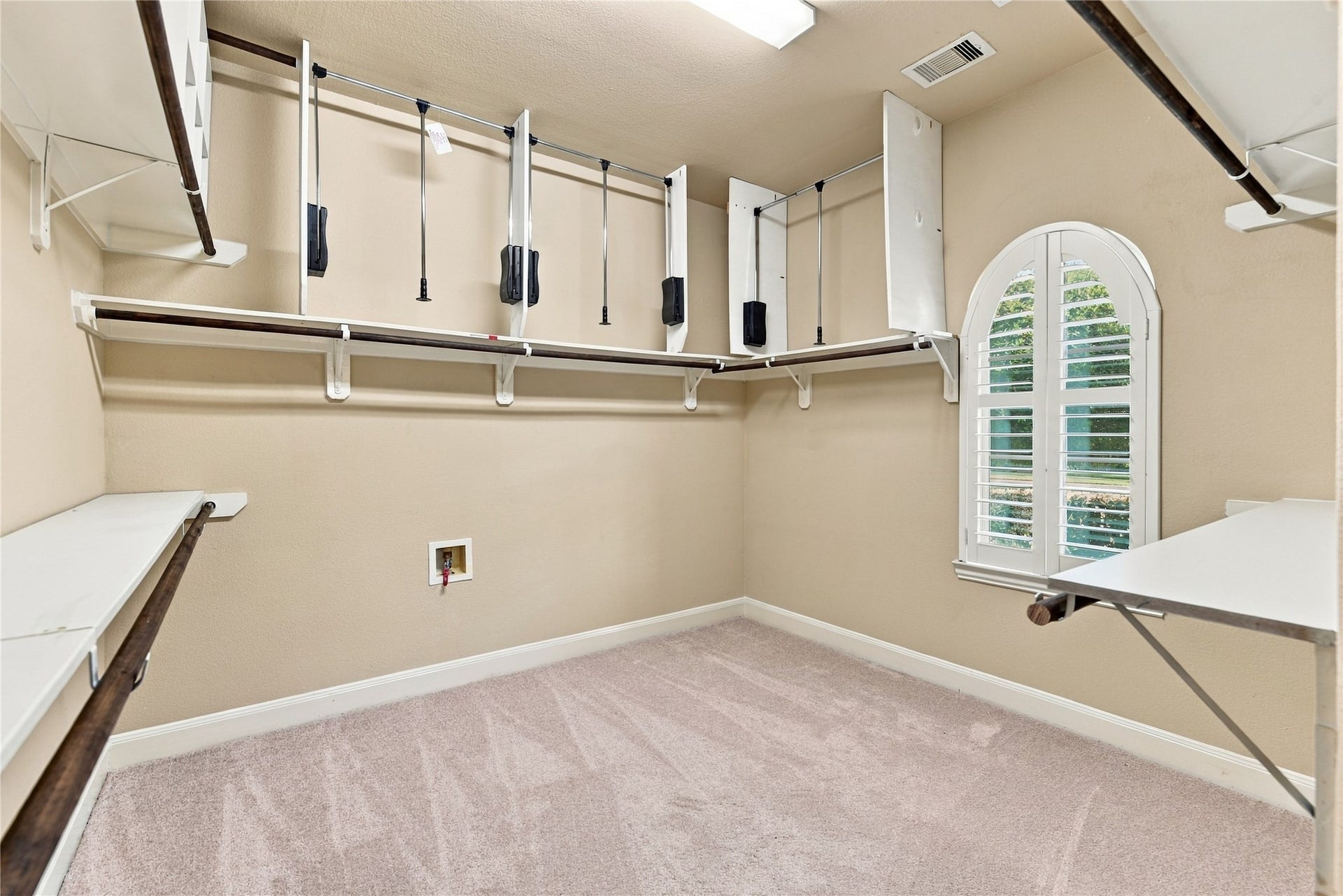 7343 Meadowcroft Boulevard, Sugar Land, TX 77479 Walk-in closet with ample shelving, hanging space and upgraded wardrobe lifts!