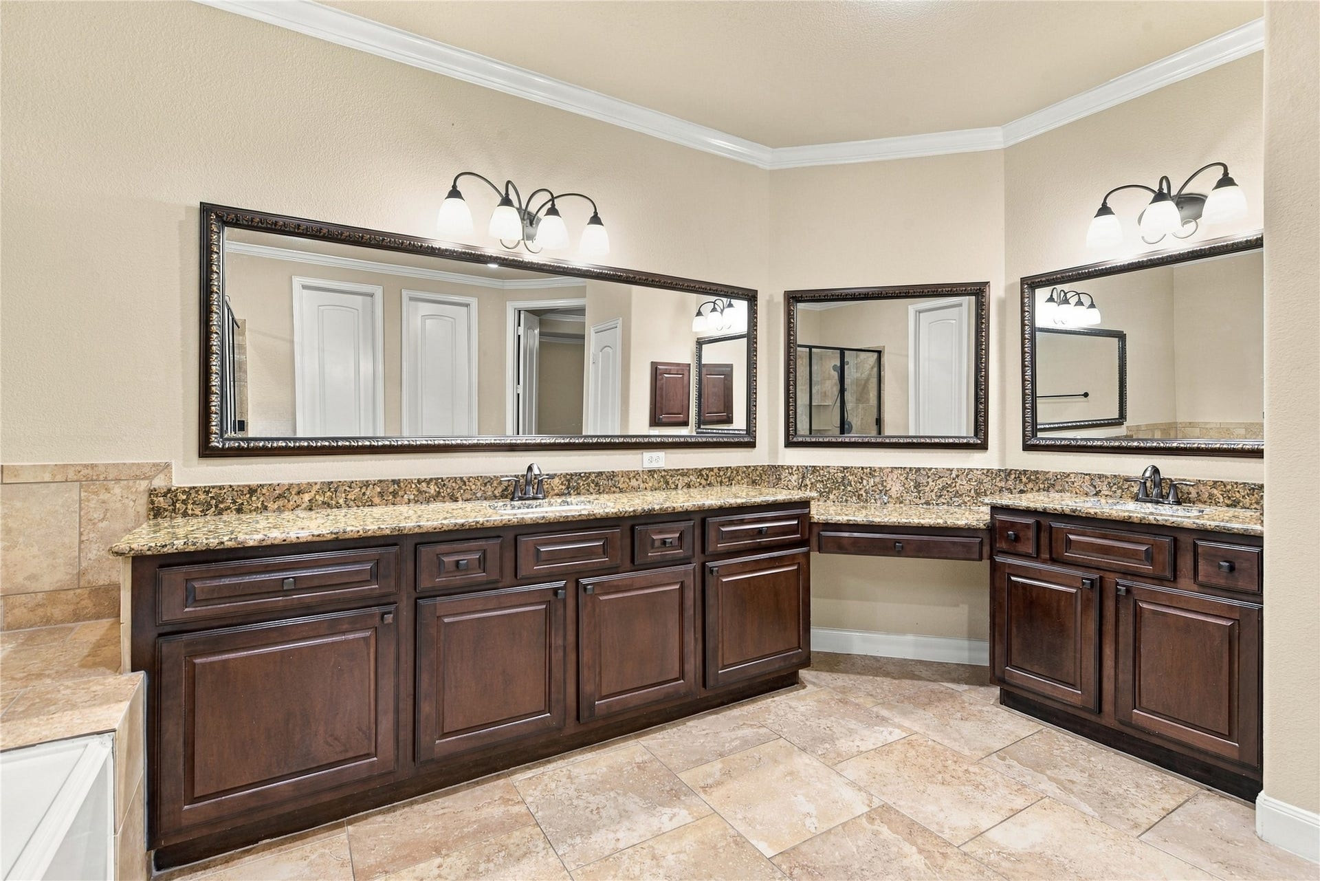 7343 Meadowcroft Boulevard, Sugar Land, TX 77479 The primary bathroom features dual sinks and expansive mirrors for a sophisticated touch.