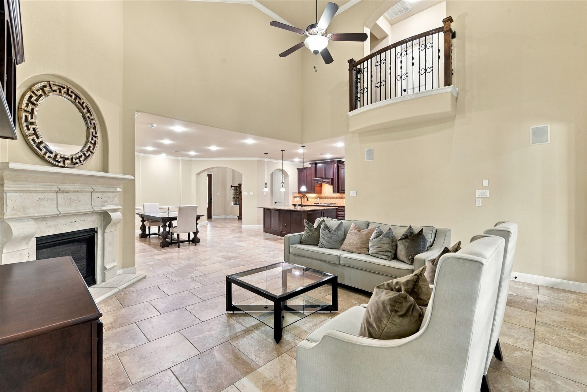 7343 Meadowcroft Boulevard, Sugar Land, TX 77479 This open floor plan connects seamlessly to the dining and kitchen areas, featuring stylish tile flooring and modern lighting.