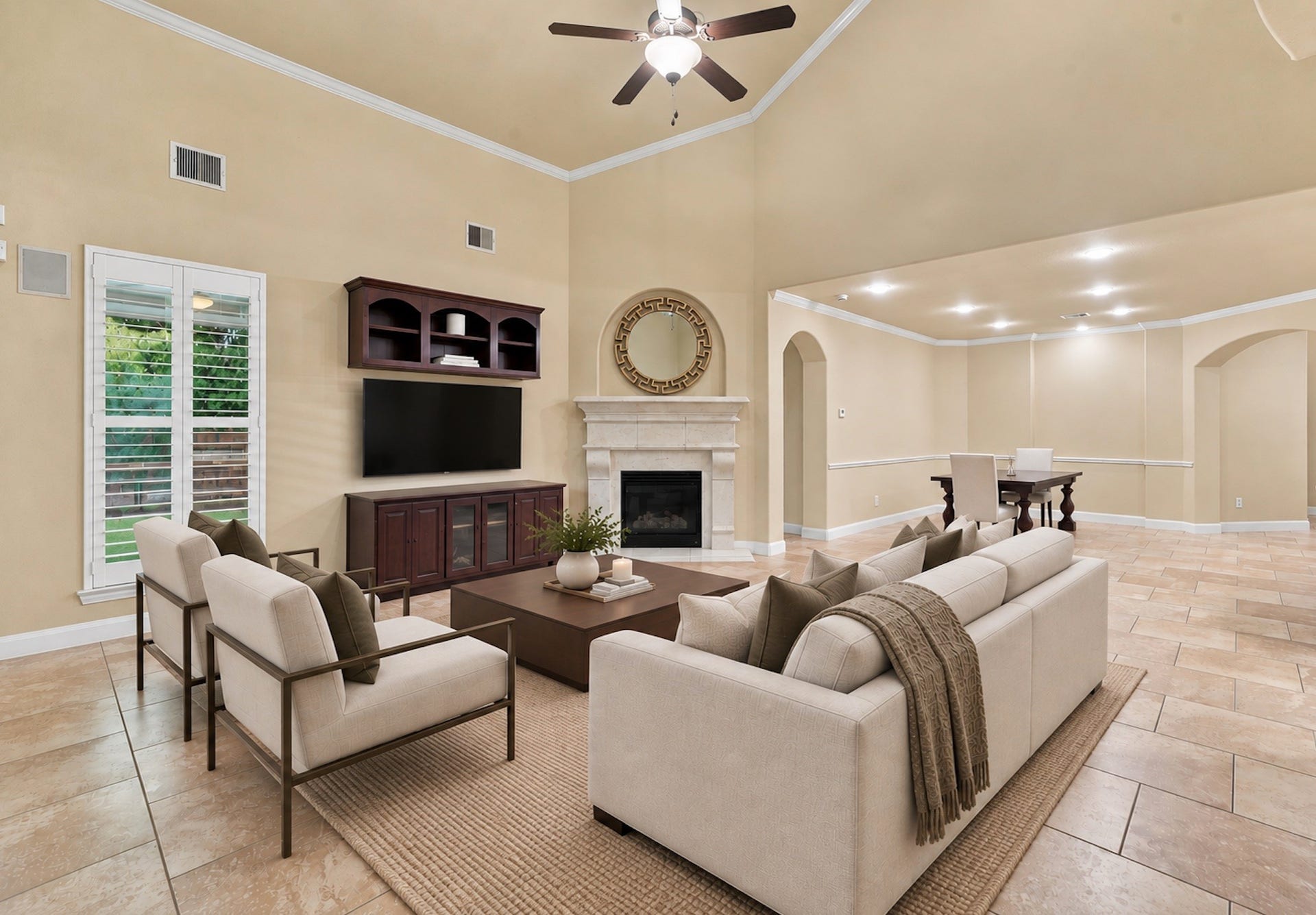 7343 Meadowcroft Boulevard, Sugar Land, TX 77479 Experience modern elegance in this virtually rendered living space, featuring high ceilings, a cozy fireplace, and an open layout perfect for entertaining.