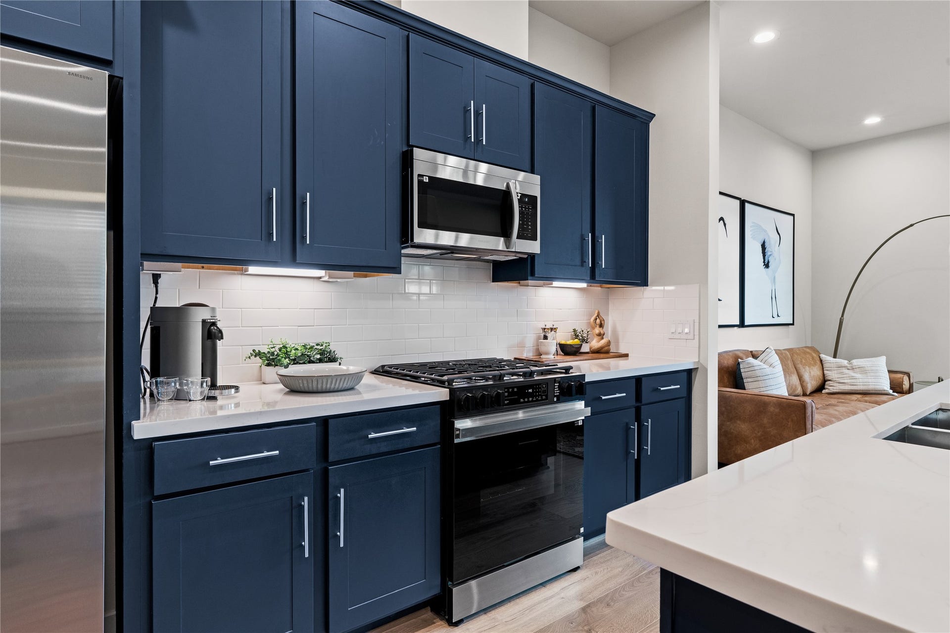 3925 Willowbend Point Drive, Houston, TX 77025 Representative photo showing the communitys model home kitchen. Layout and selections may vary.