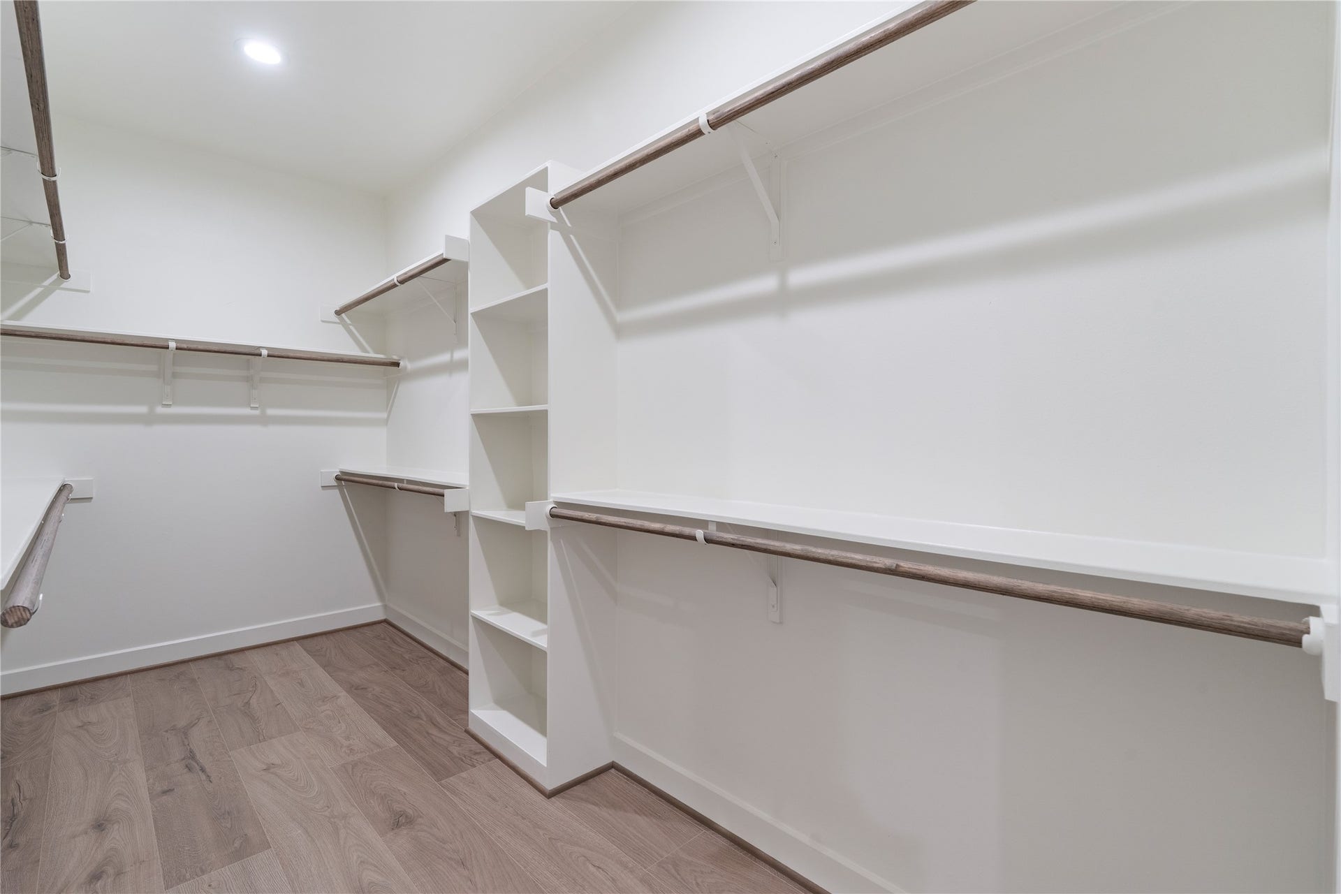 3925 Willowbend Point Drive, Houston, TX 77025 Representative photo showing the communitys model home primary walk-in closet. Layout and selections may vary.