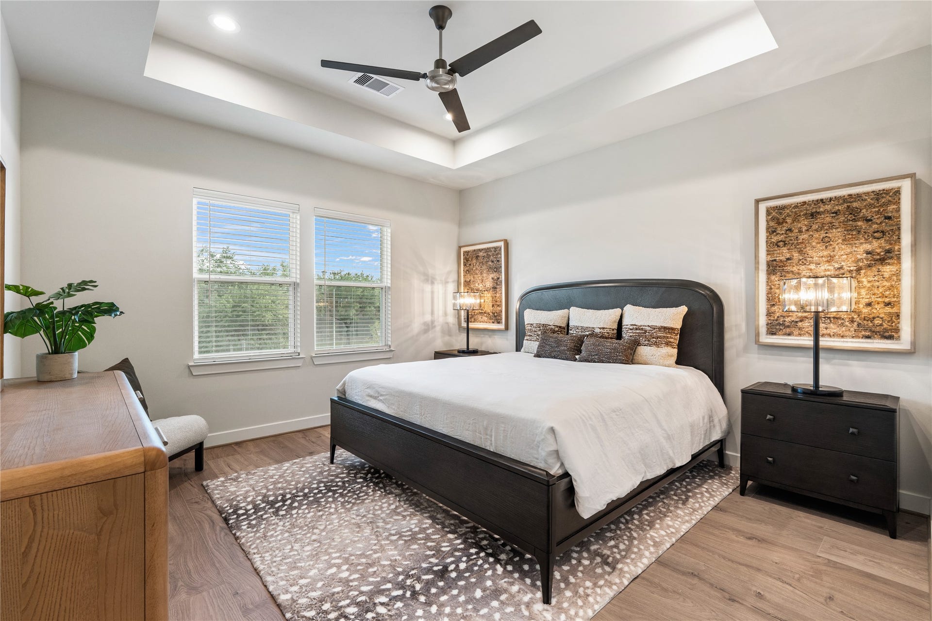3925 Willowbend Point Drive, Houston, TX 77025 Representative photo showing the communitys model home primary bedroom. Layout and selections may vary.