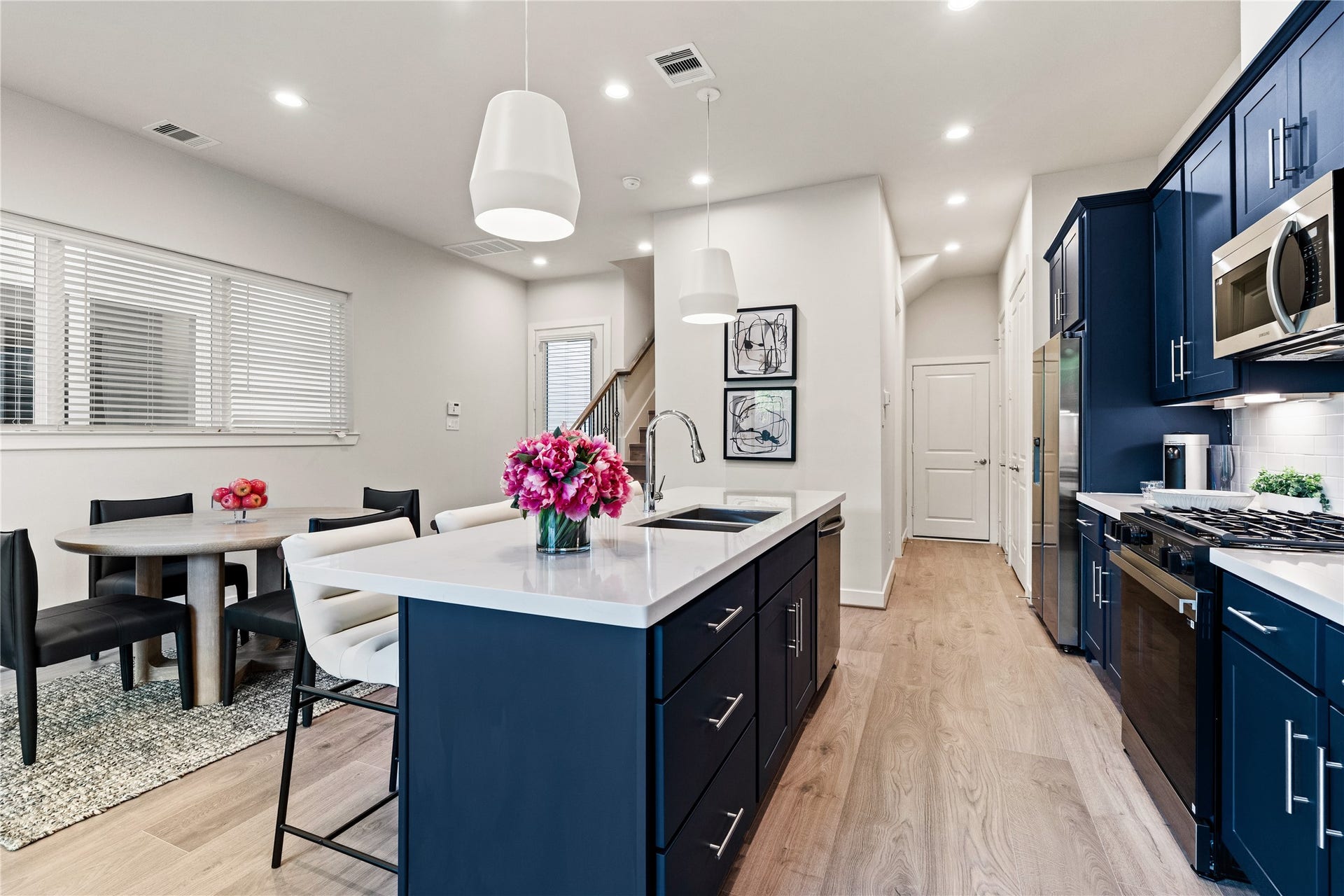 3925 Willowbend Point Drive, Houston, TX 77025 Representative photo showing the communitys model home kitchen. Layout and selections may vary.
