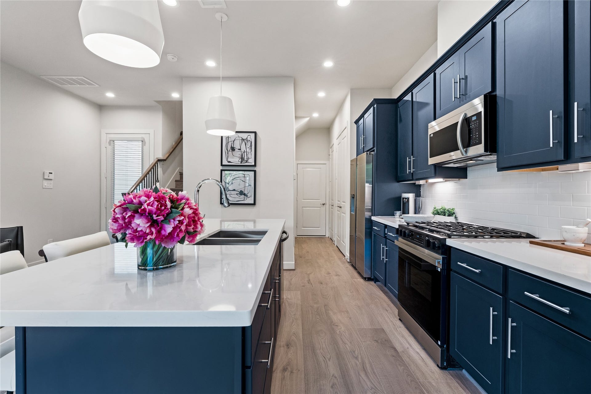 3925 Willowbend Point Drive, Houston, TX 77025 Representative photo showing the communitys model home kitchen. Layout and selections may vary.