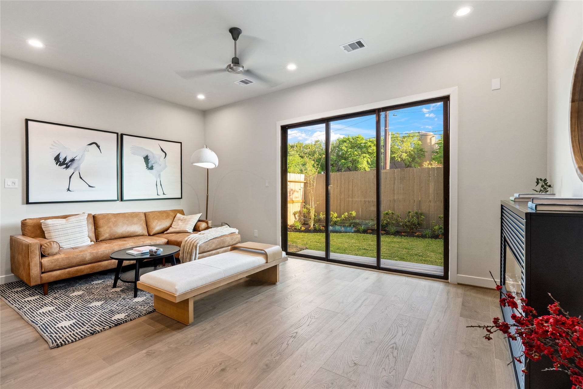 3925 Willowbend Point Drive, Houston, TX 77025 Representative photo showing the communitys model home living room. Layout and selections may vary.