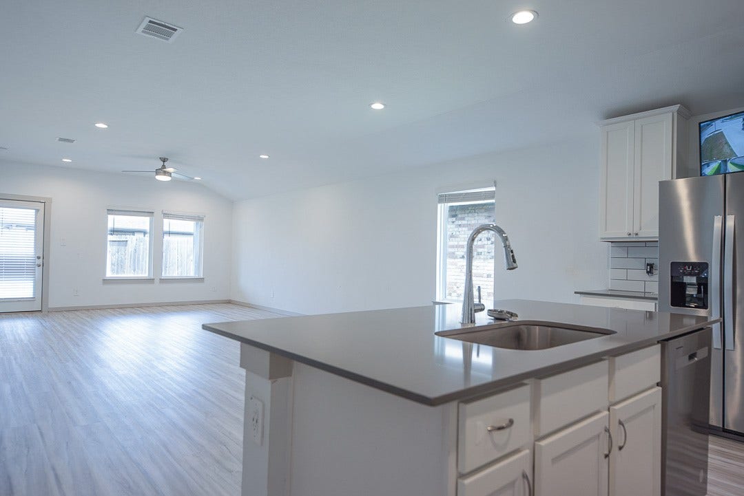 6906 Halifax Harvest Lane, Richmond, TX 77407 Enjoy seamless living with an open kitchen flowing into the dining and living area, ideal for entertaining and everyday comfort.
