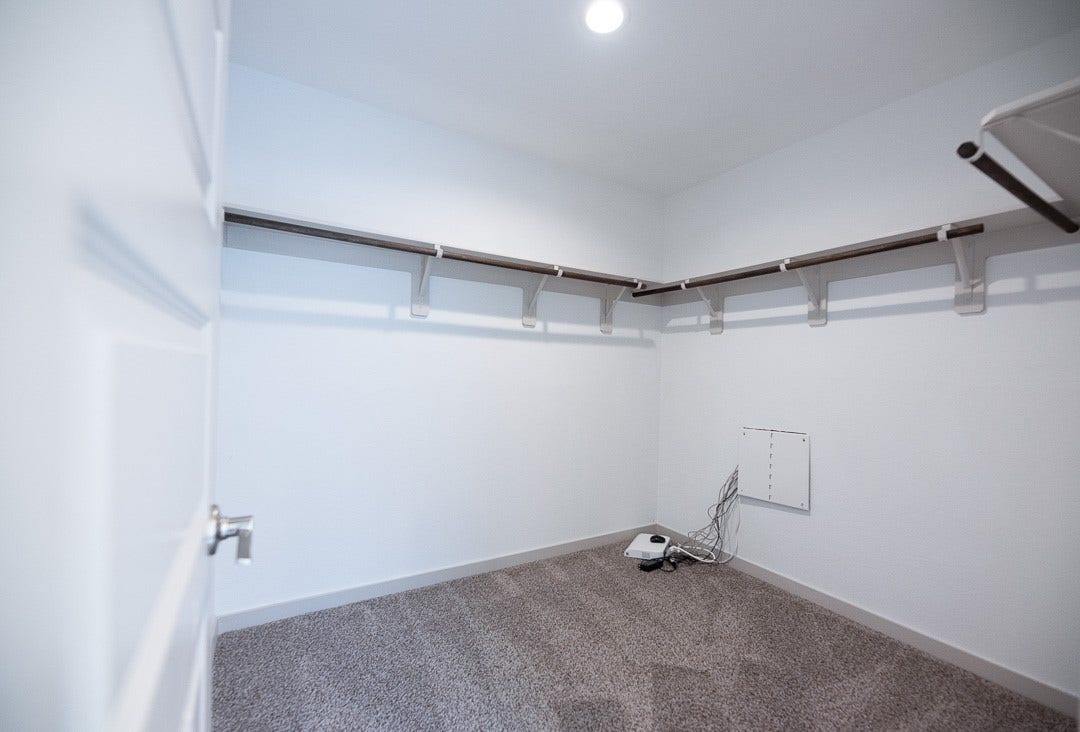 6906 Halifax Harvest Lane, Richmond, TX 77407 Expansive walk-in closet, perfectly designed to accommodate all your wardrobe needs.