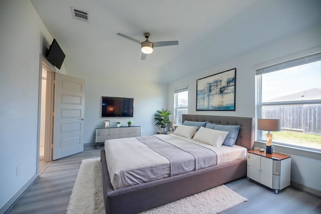 6906 Halifax Harvest Lane, Richmond, TX 77407 The primary bedroom offers a bright and inviting retreat, enhanced with abundant natural light. (virtually staged)