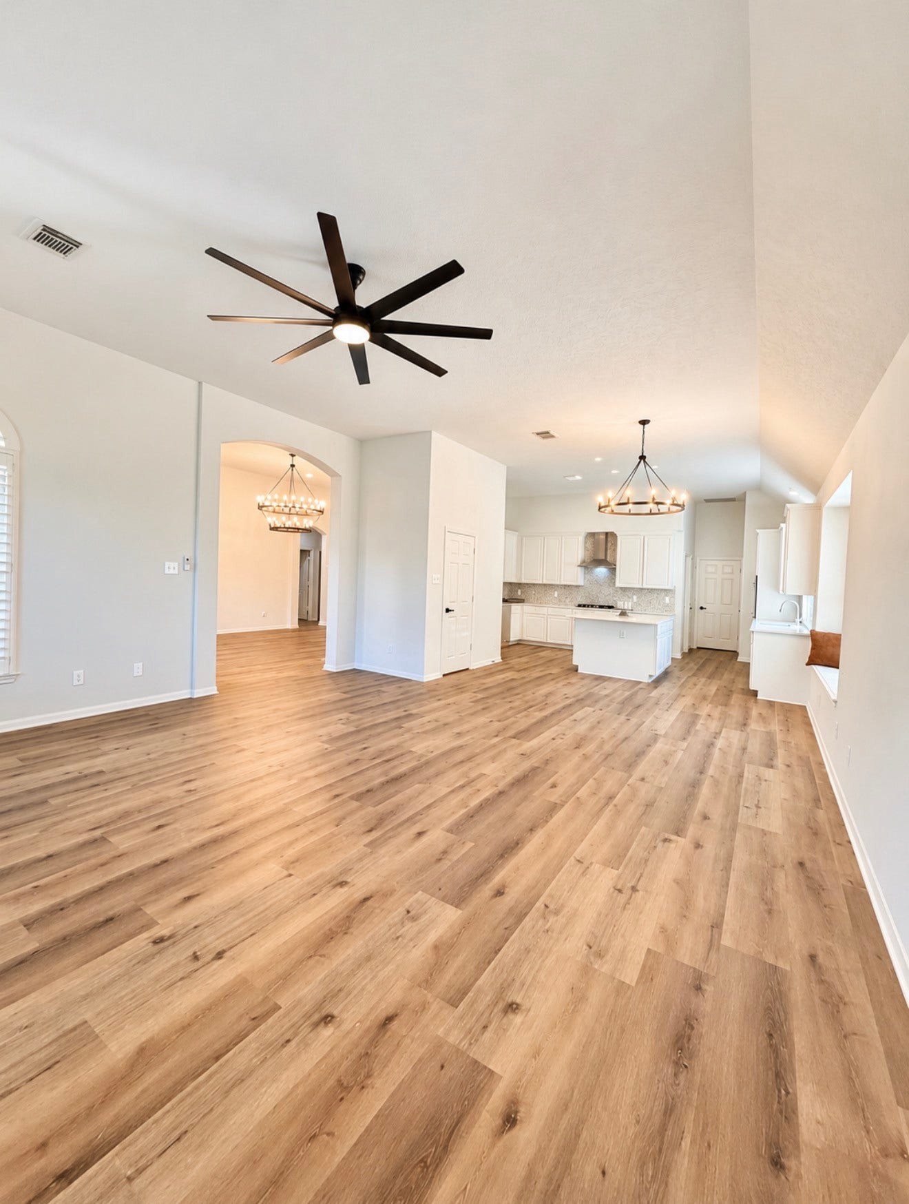 20434 Long Cypress Drive, Spring, TX 77388 The large space w/ high ceilings includes the family area, breakfast area, and kitchen
