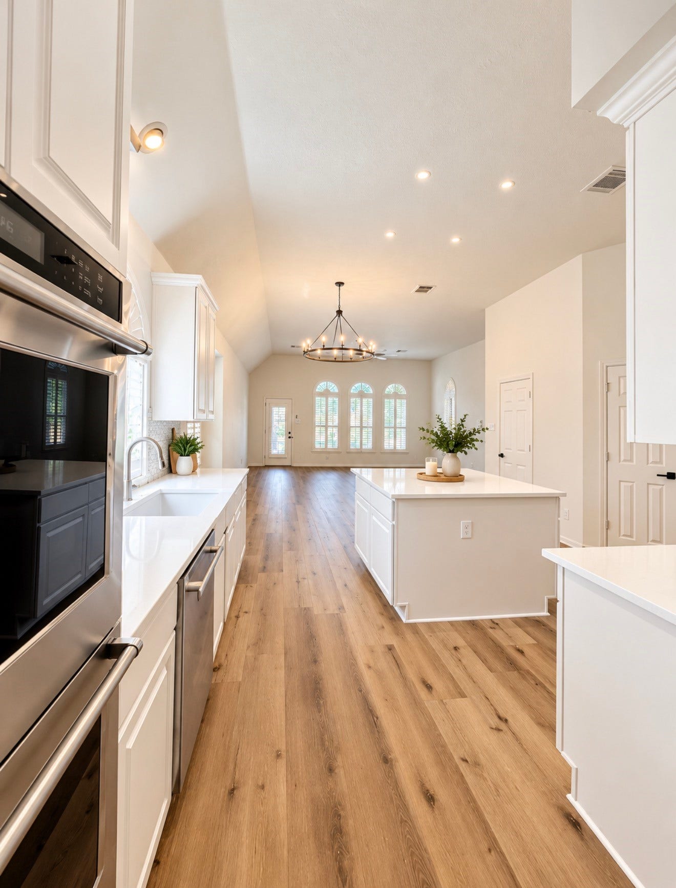 20434 Long Cypress Drive, Spring, TX 77388 View of the kitchen, breakfast area, and family room. The powder bath and third pantry are on each side behind where this photo is taken as well as the laundry room.