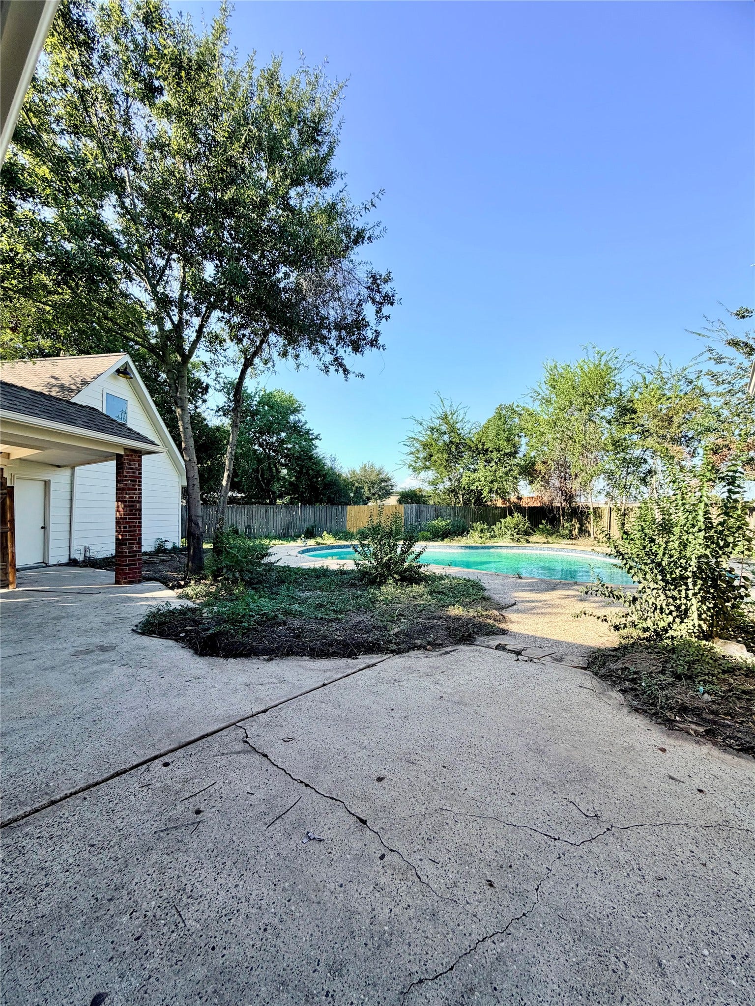 20434 Long Cypress Drive, Spring, TX 77388 View from the covered back porch to the large pool and yard