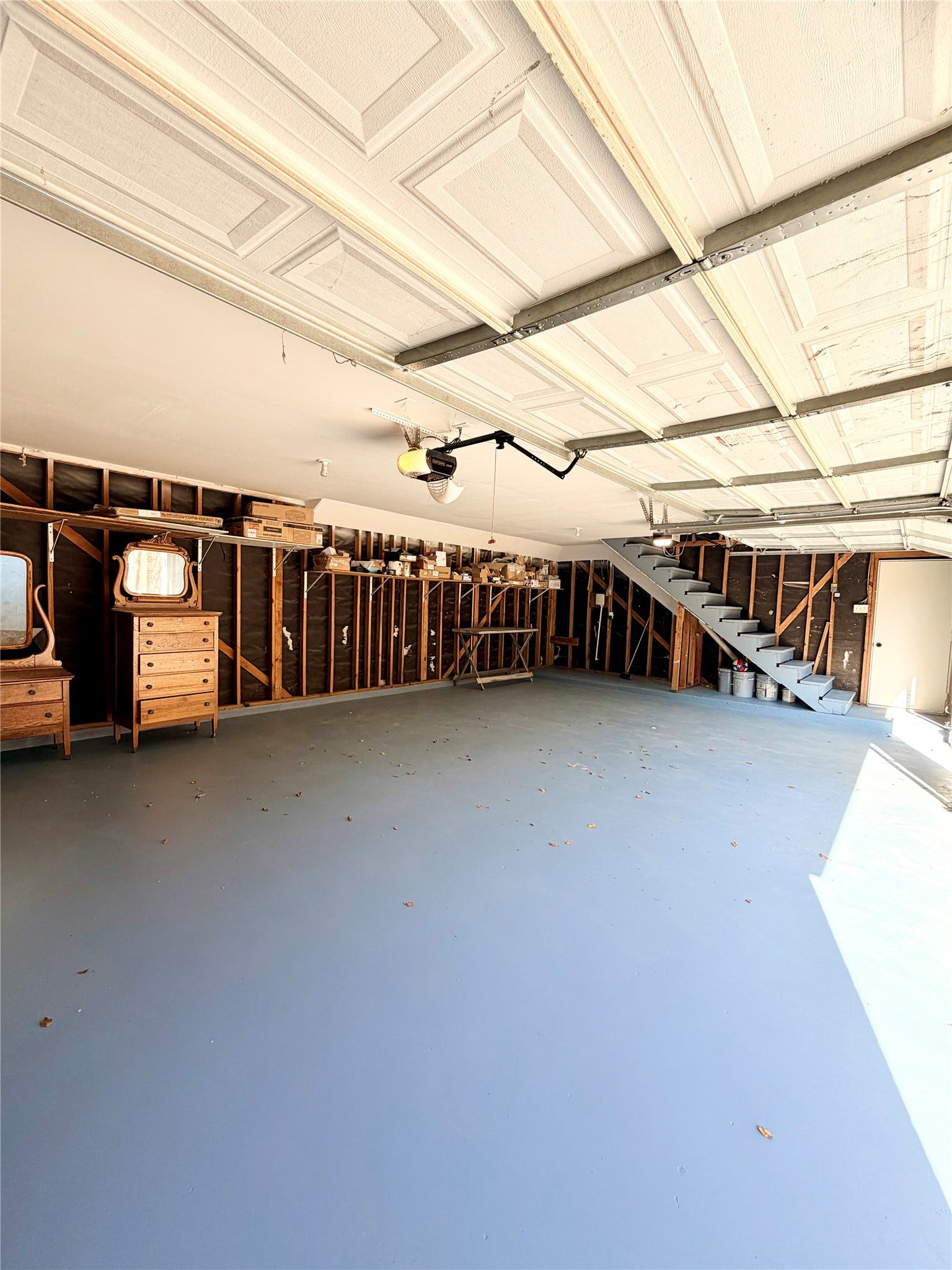 20434 Long Cypress Drive, Spring, TX 77388 3 car garage w/ stairs leading to the ADU above (bedroom & ensuite bathroom)