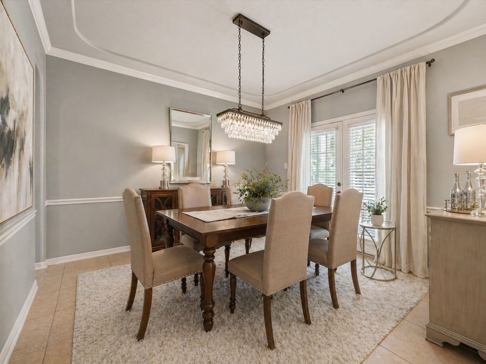 ELEGANT FORMAL DINING ROOM WITH TRAY CEILING AND LARGE WINDOWS FOR NATURAL LIGHT. A PERFECT SETTING FOR ENTERTAINING. **Virtually Staged.
