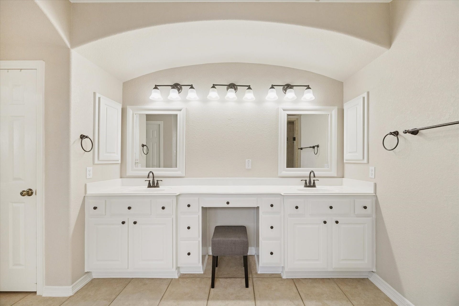 DOUBLE VANITY SETUP WITH AMPLE STORAGE AND COUNTER SPACE, IDEAL FOR A BUSY HOUSEHOLD.