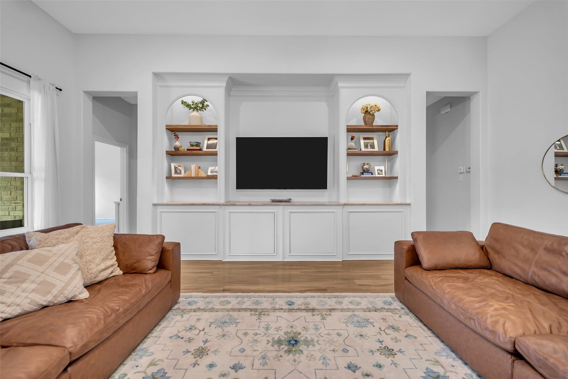 14663 Diamond Shores, Willis, TX 77378 Spacious family room featuring custom built-ins with Taj Majal quartzite and hidden storage