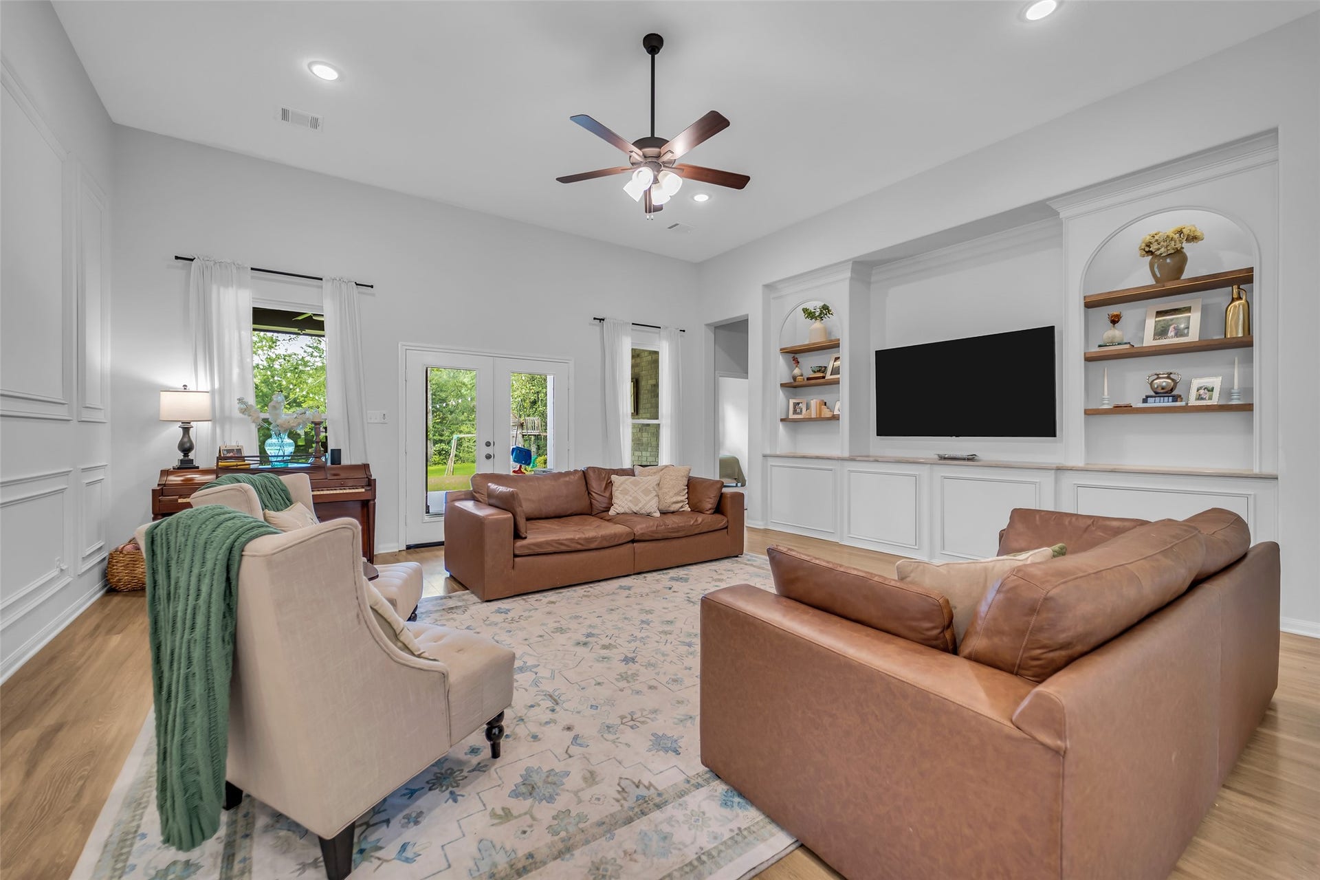14663 Diamond Shores, Willis, TX 77378 Spacious family room with built-ins, picture-frame molding, and french doors to the backyard
