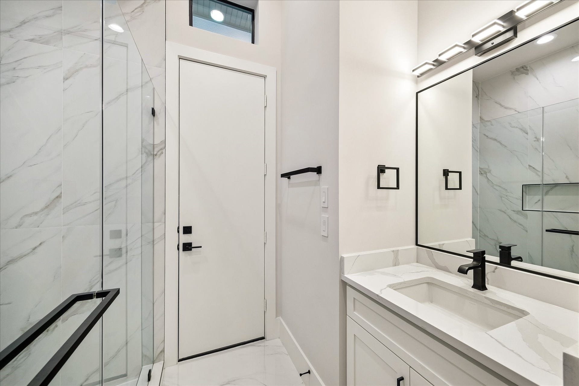 Dedicated pool bathroom w/shower opens to the backyard.
